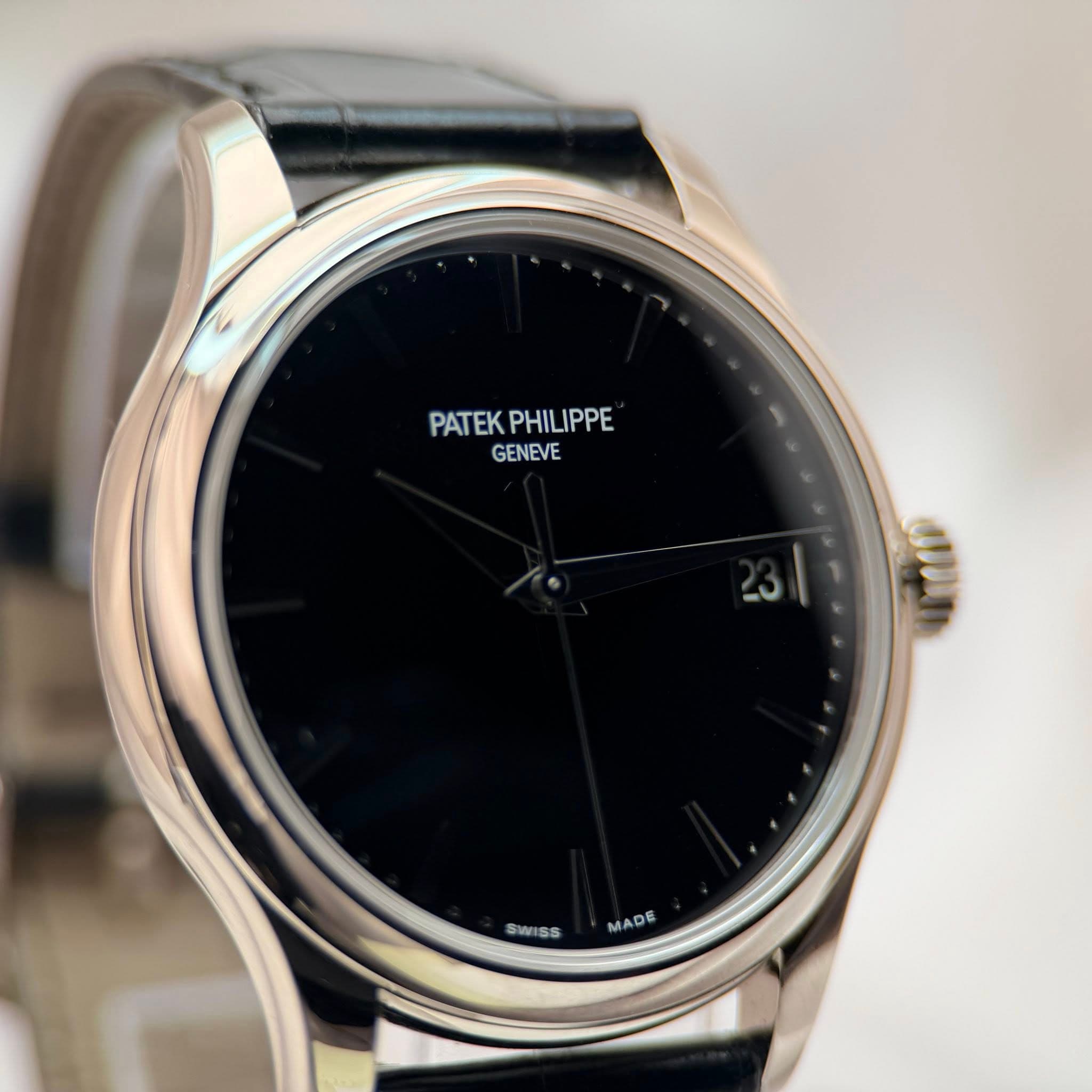May be an image of wrist watch and text that says 'PATEKPHILIPPE PATEK PHILIPPE GENEVE dn SWISS ss SM MADE M'