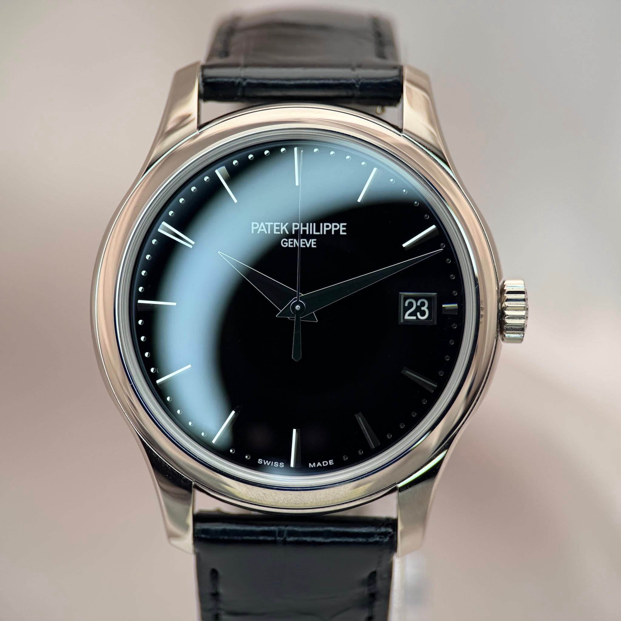 May be an image of wrist watch and text that says 'PATEK PATEKPHILIPPE PHIL IPPE PHILIPPE GENEVE 23 I. SWISS MADE'