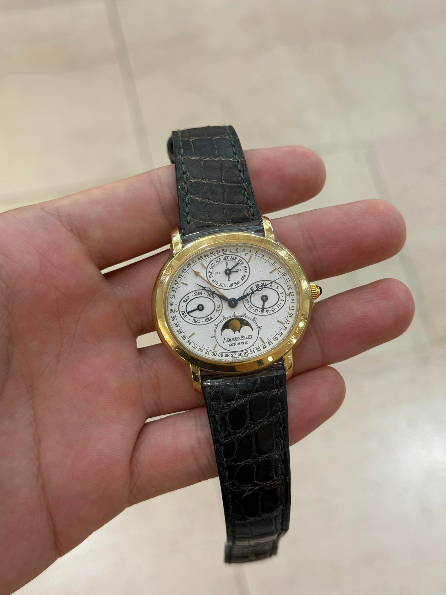 May be an image of wrist watch and text