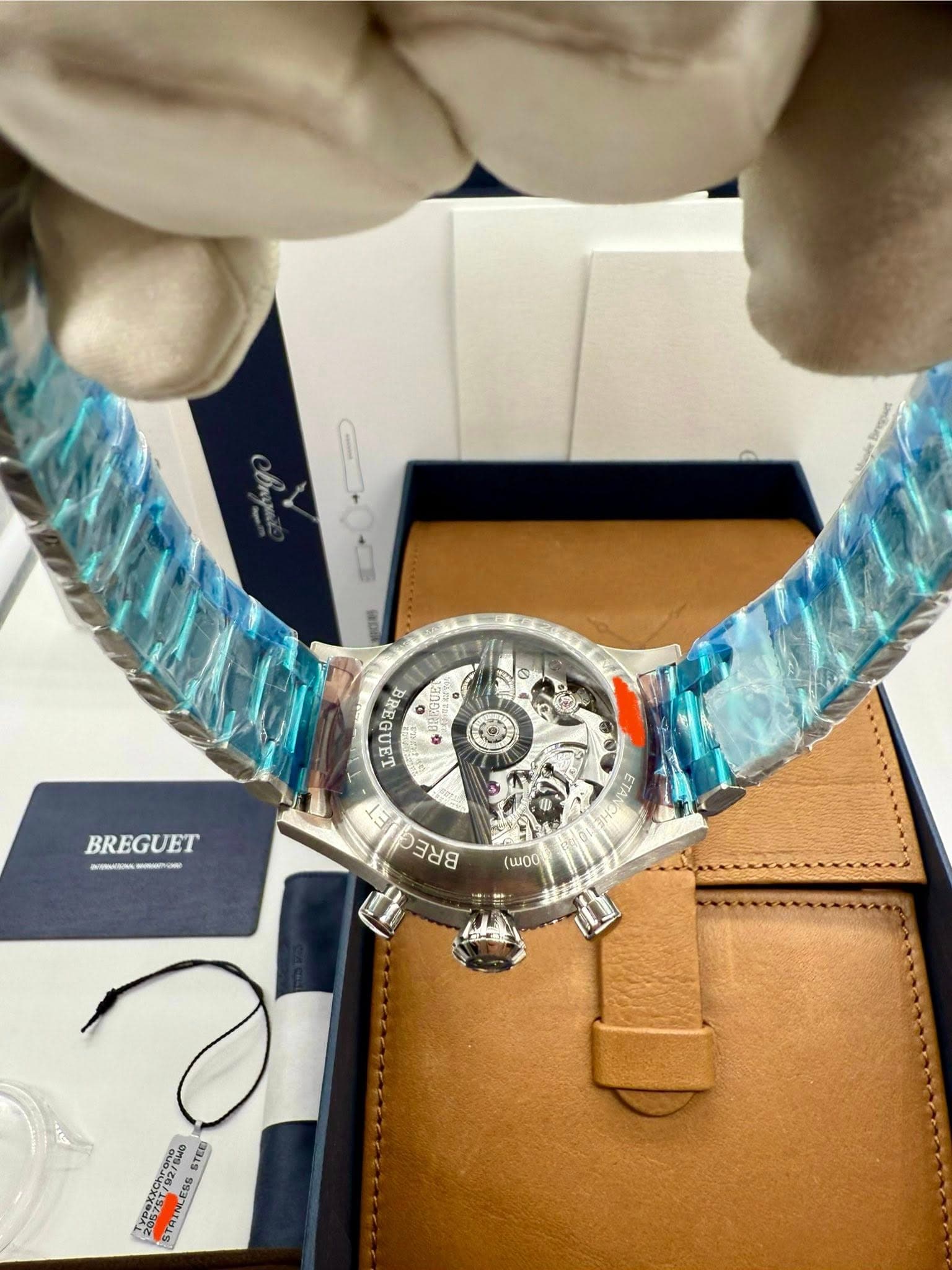 May be an image of wrist watch and text