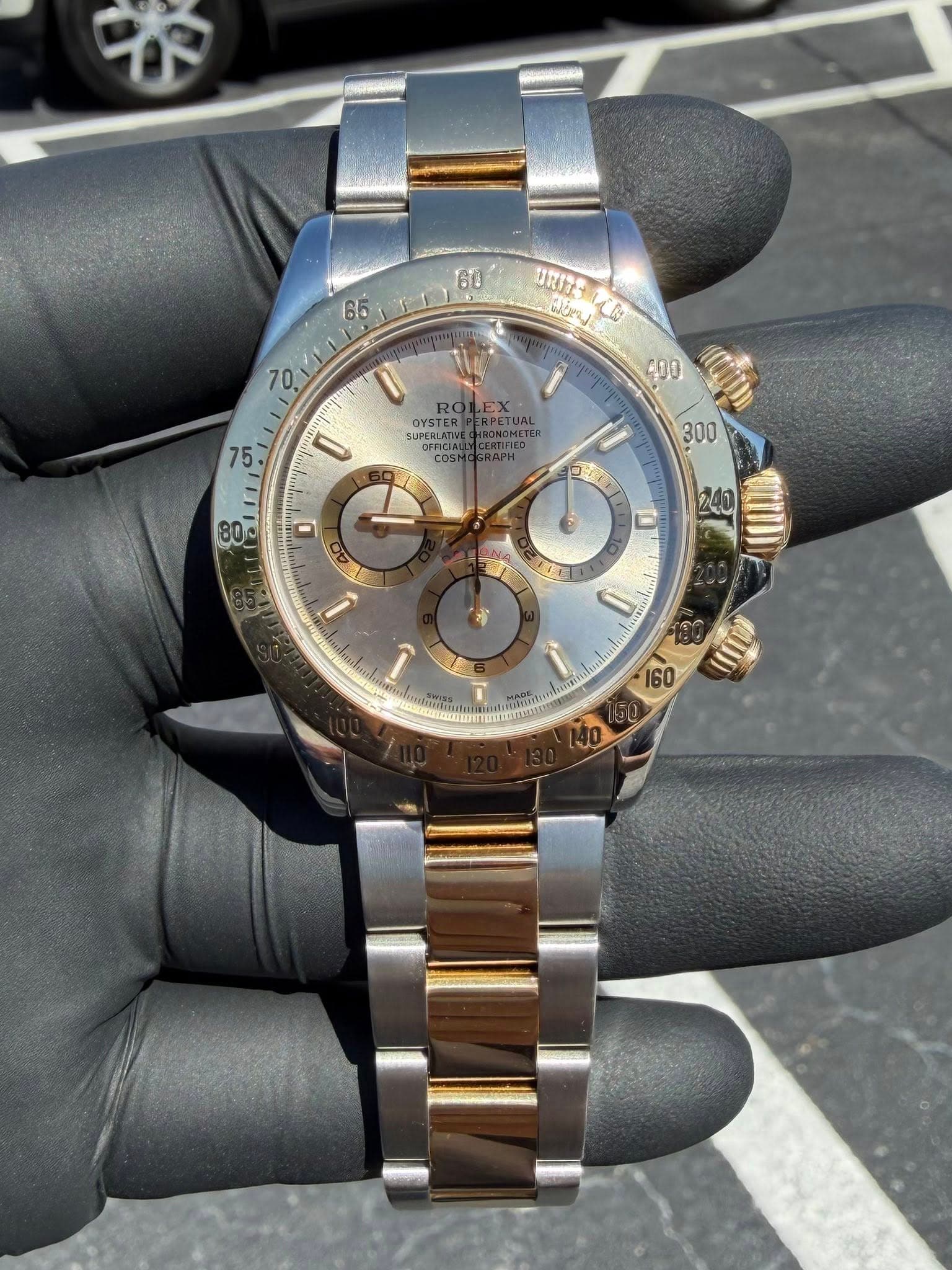 May be an image of wrist watch and text