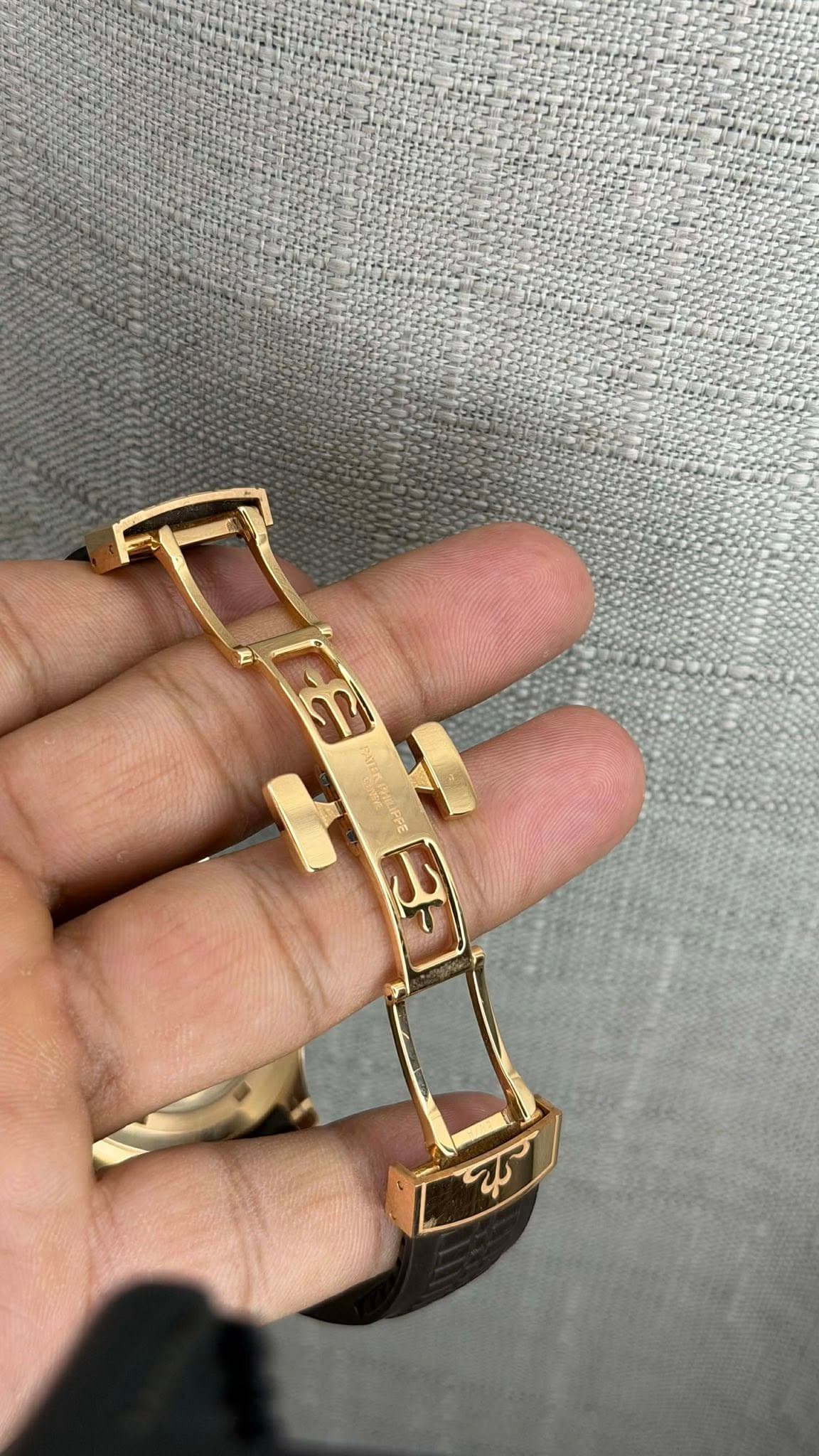 May be an image of wrist watch and text