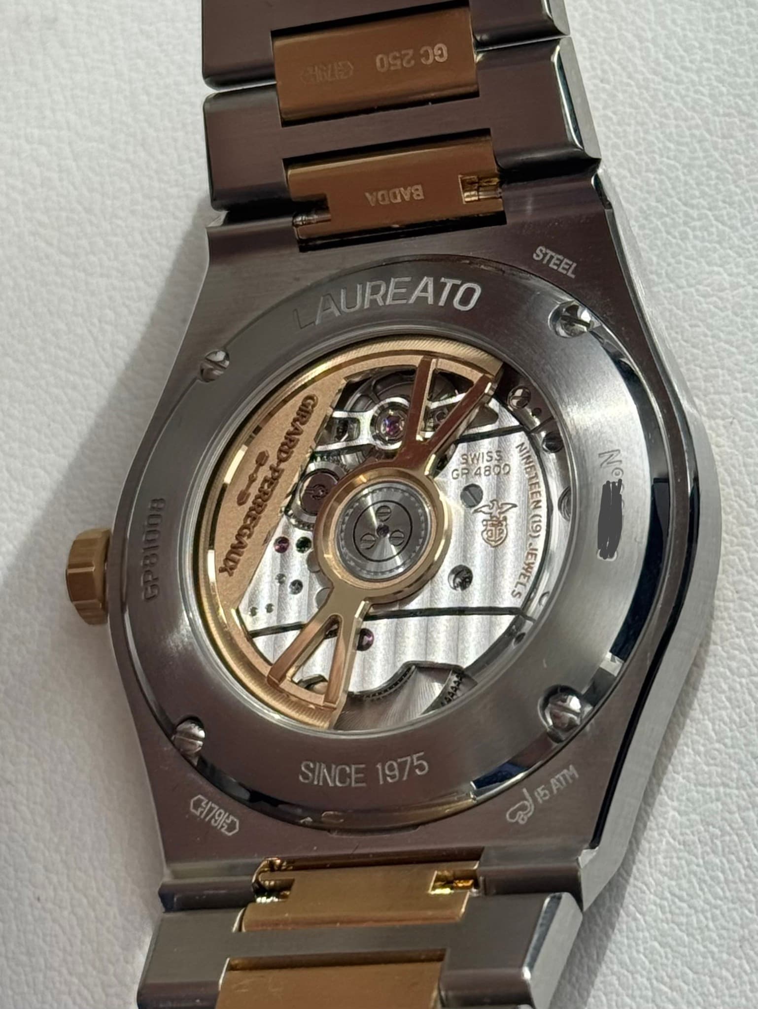 May be an image of wrist watch and text