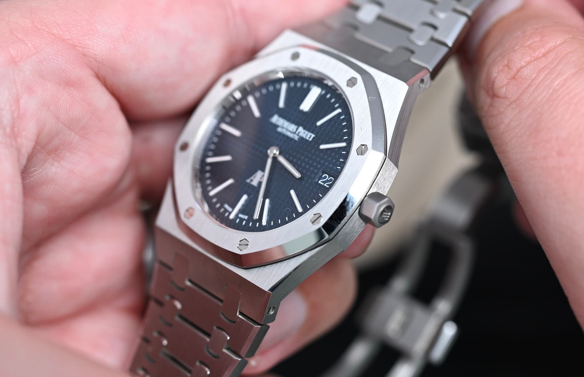 May be an image of wrist watch and text