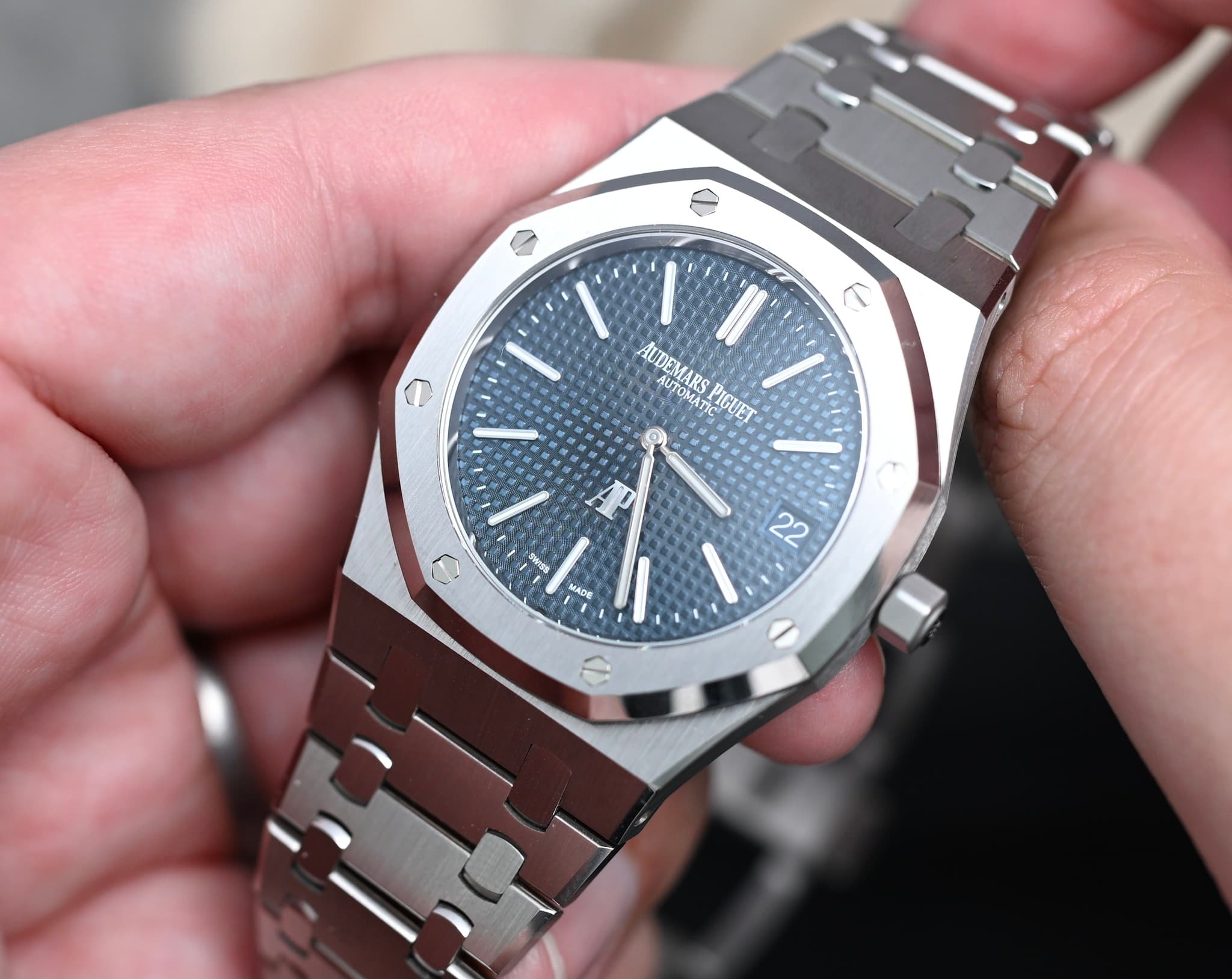 May be an image of wrist watch and text