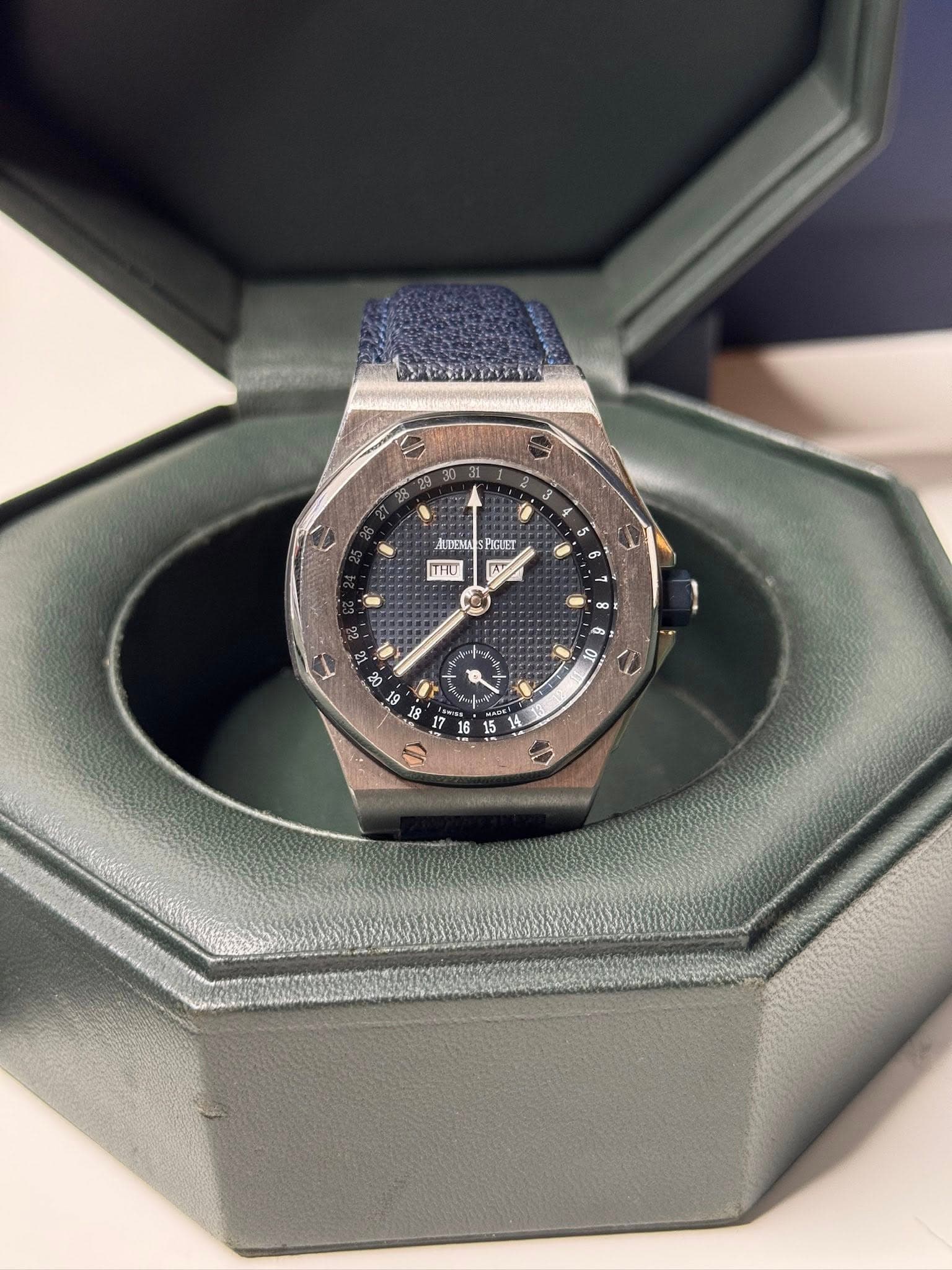 May be an image of wrist watch and text that says ' - AUDENU ALDEMUSPOLET POUET THO'