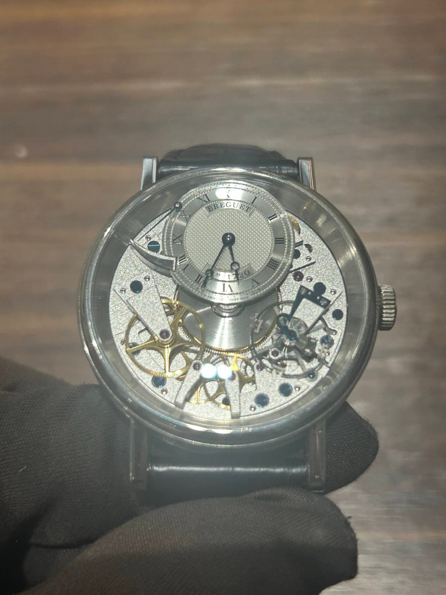 May be an image of wrist watch and text