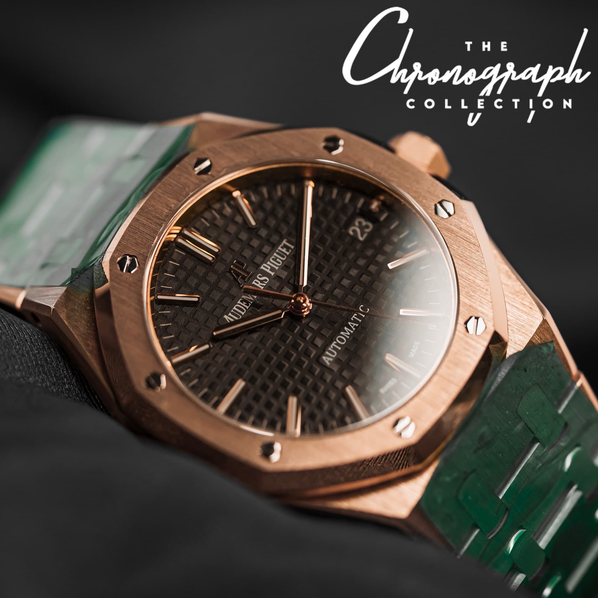 May be an image of wrist watch and text that says 'Cyjanagaph T THE nronograph COLLECTION CTION PIGUET IGUI RS AUDE اری ABTOMΑTΟ'