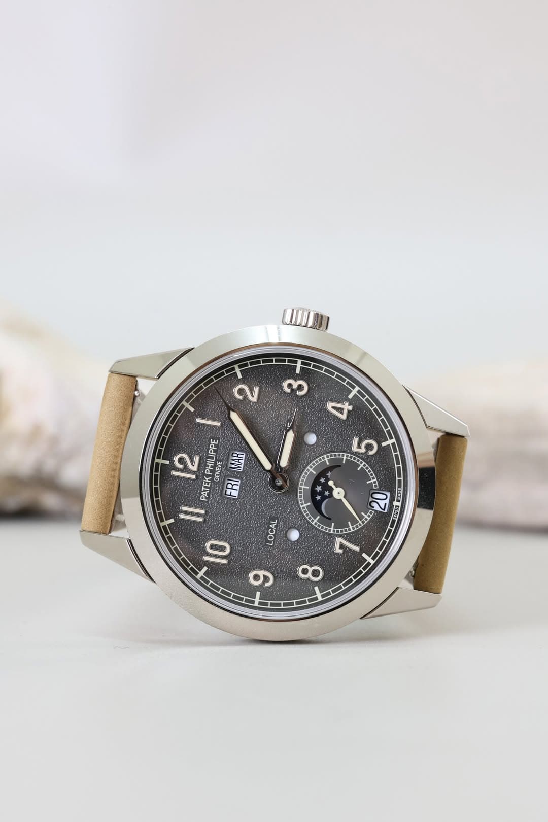 May be an image of wrist watch and text