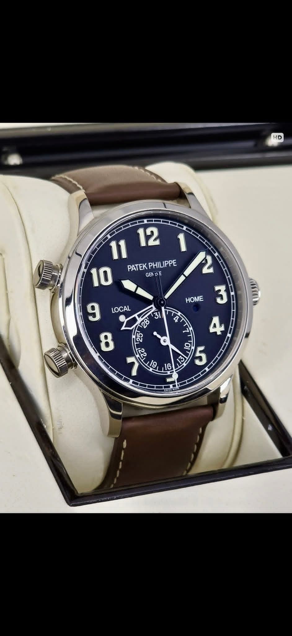 May be an image of wrist watch and text that says 'HD 11 12 10 PATEKPHILIPPE PATEK PHILIPPE GEN IE 12 3 LOCAL HOME IU L A 5 I E S פ ਮ SS تيا'