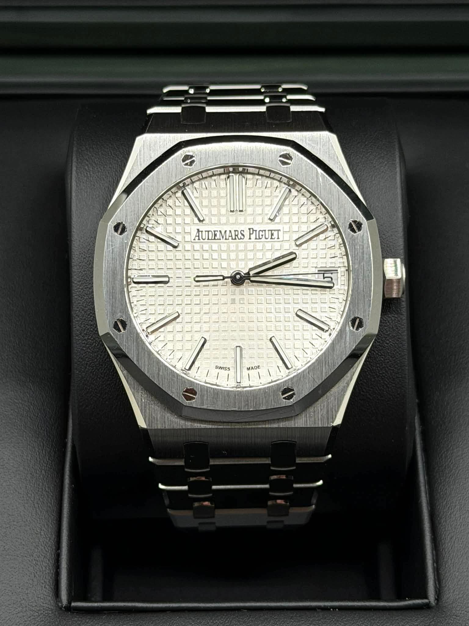 May be an image of wrist watch and text