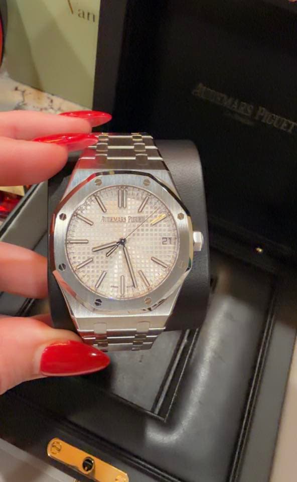 May be an image of wrist watch and text