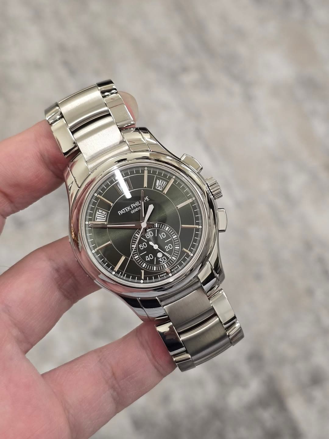 May be an image of wrist watch and text