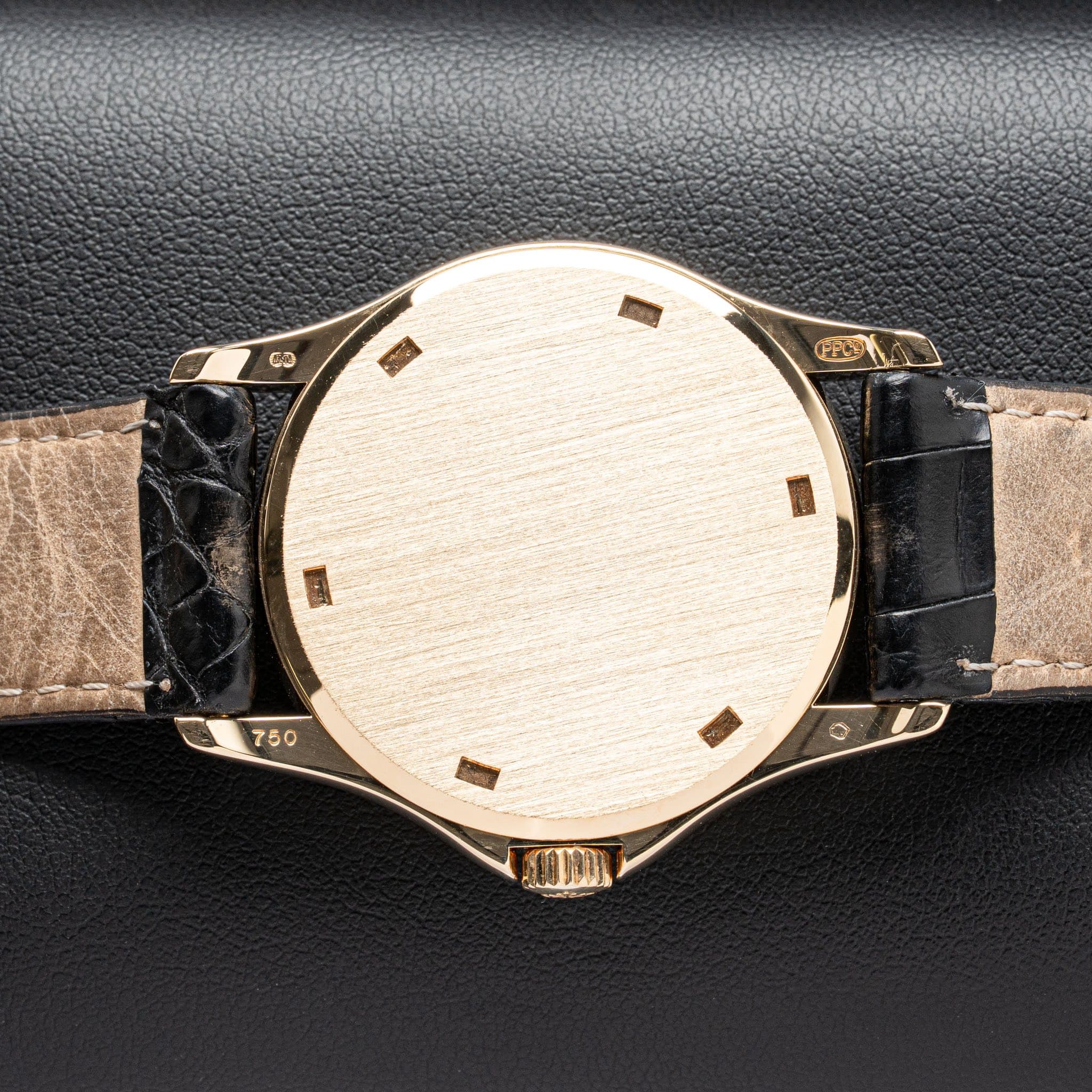 May be an image of leather and wrist watch