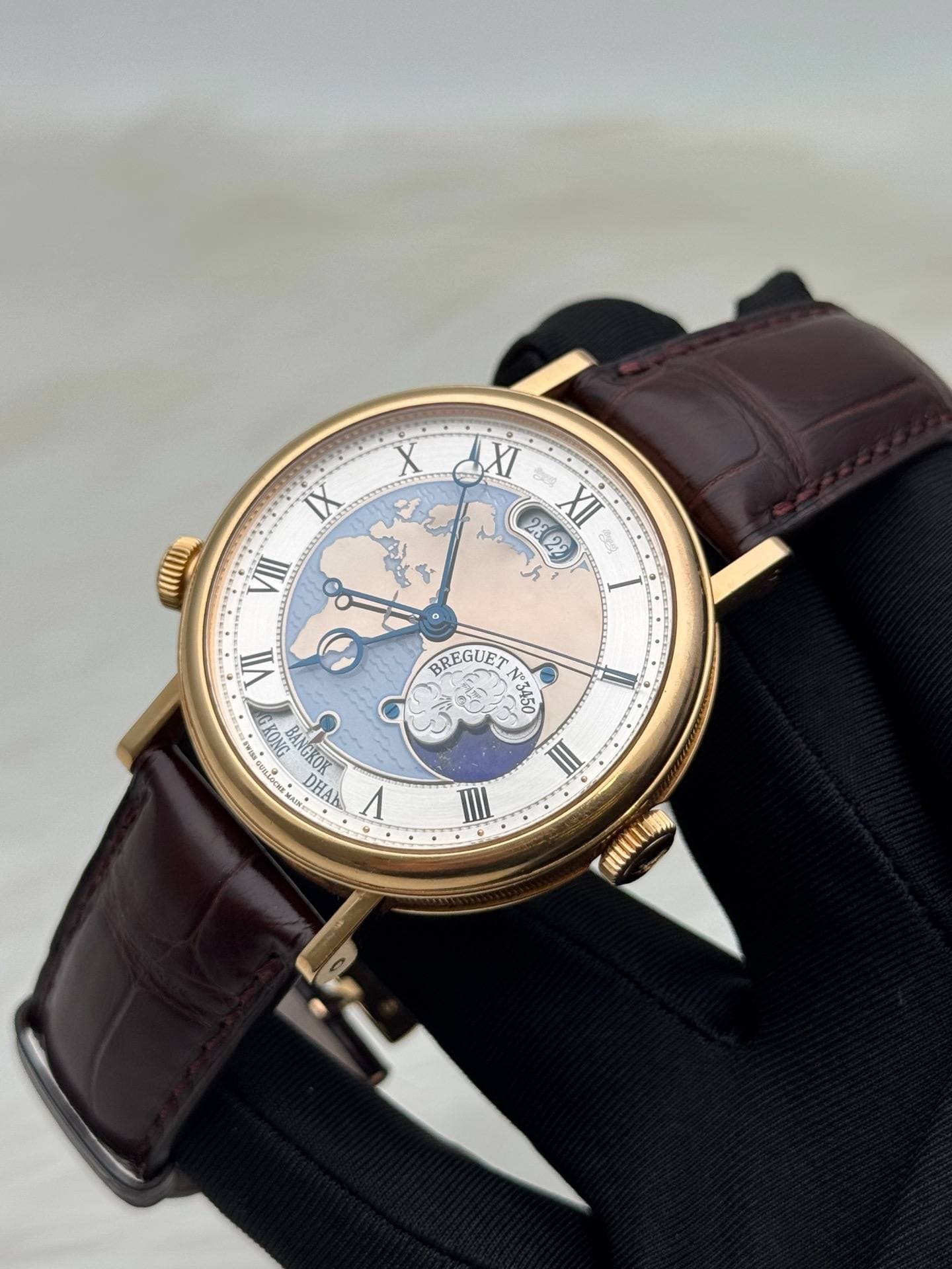 May be an image of wrist watch and text