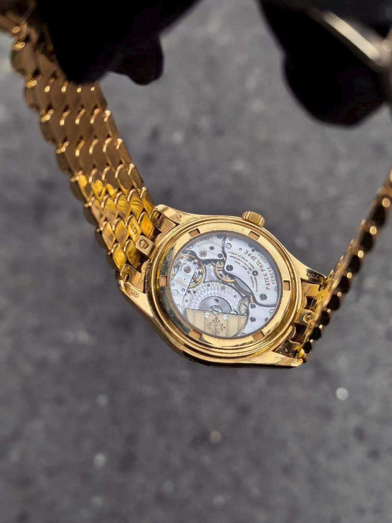 May be an image of wrist watch and text