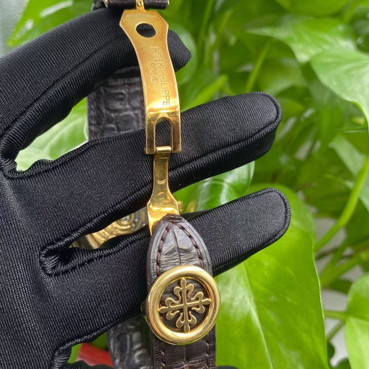 May be an image of wrist watch and leather