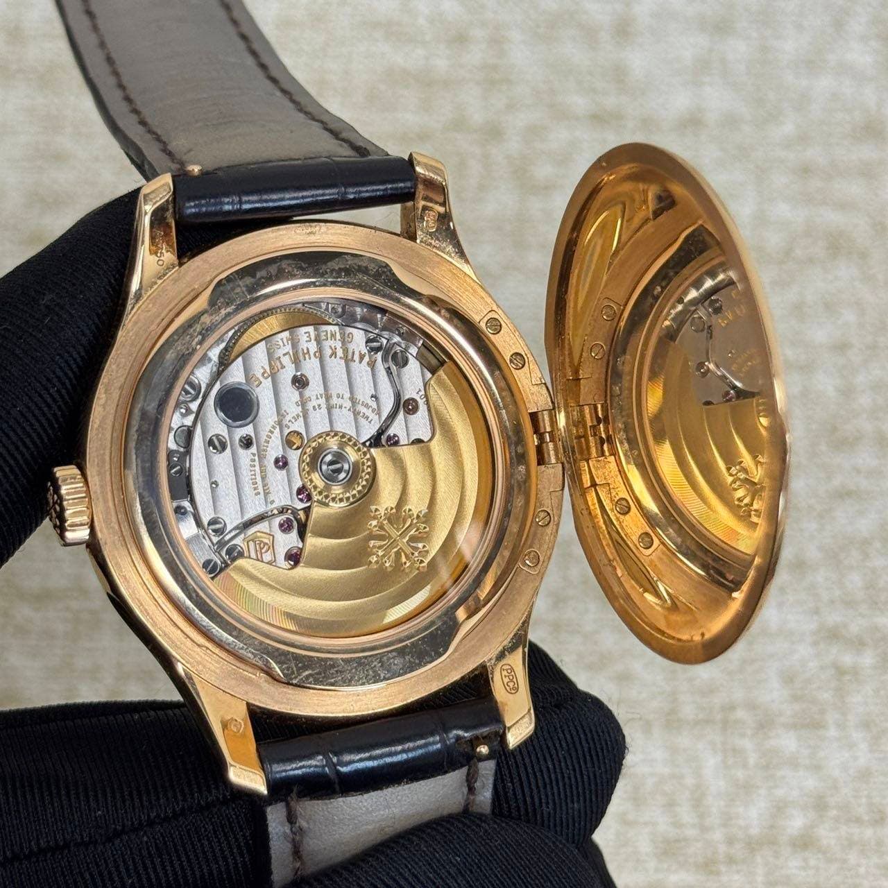 May be an image of wrist watch and text