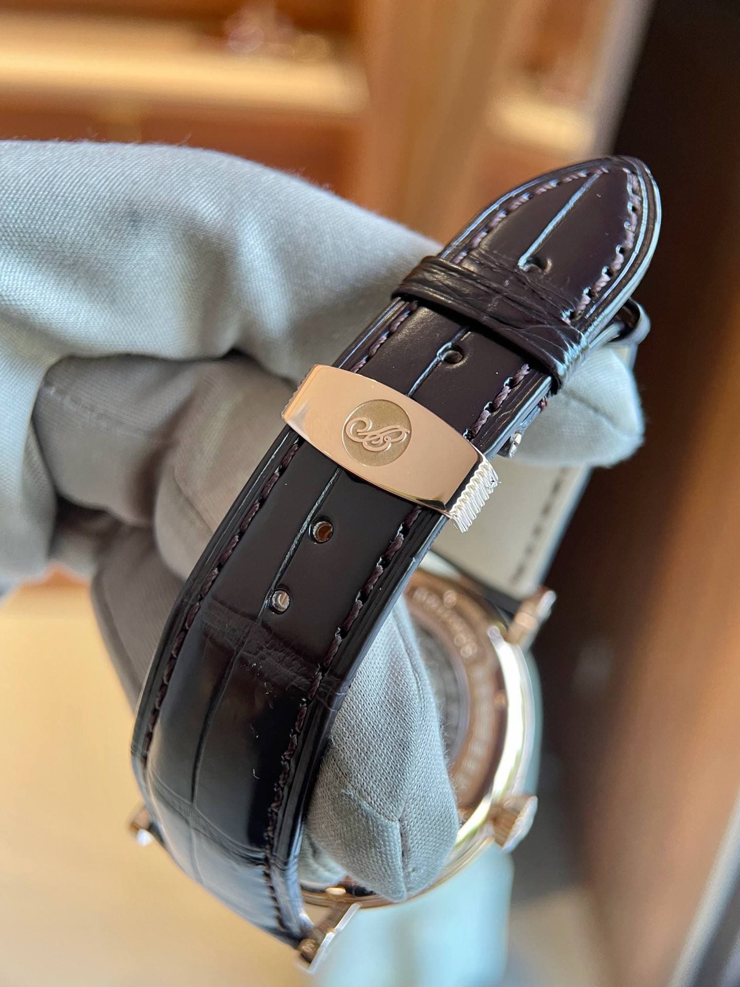 May be an image of wrist watch and text