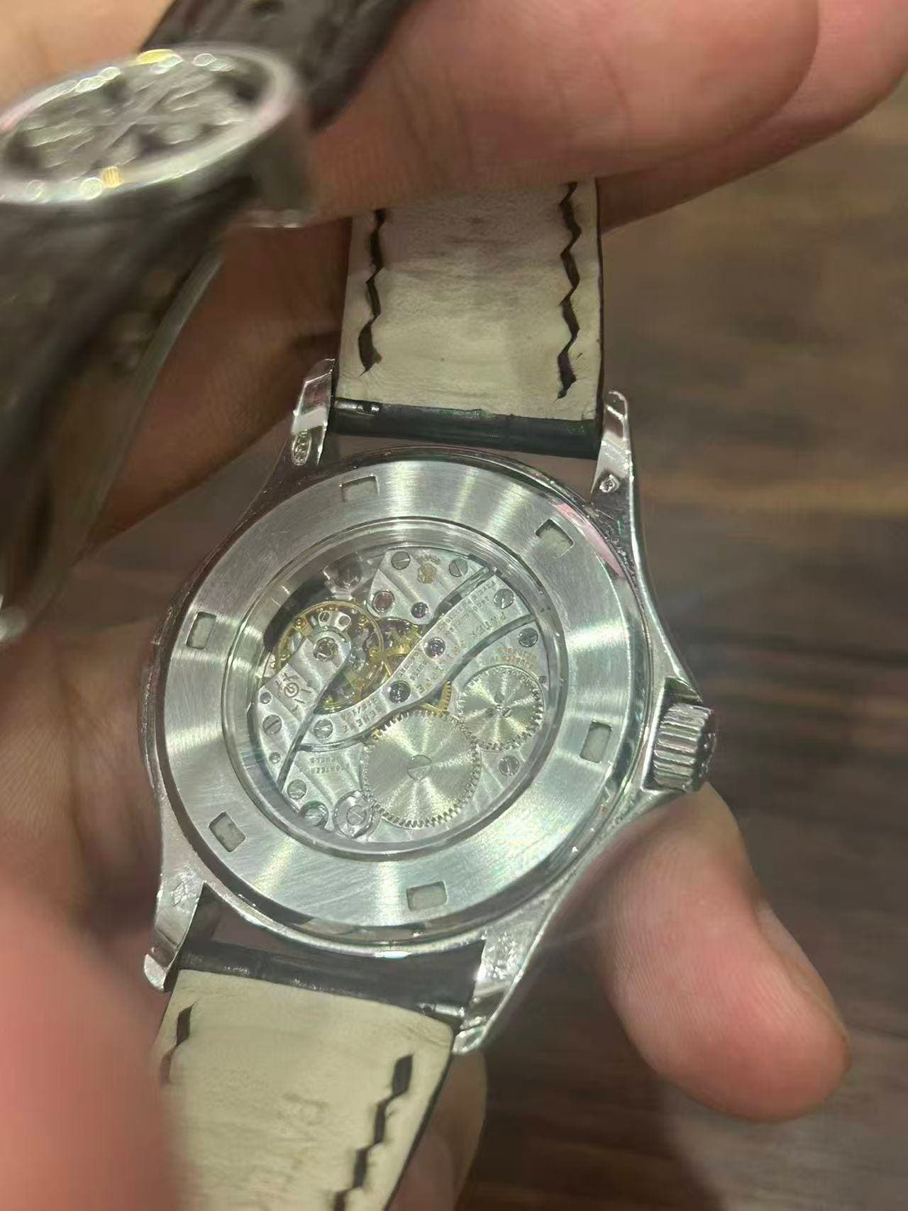 May be an image of wrist watch and text