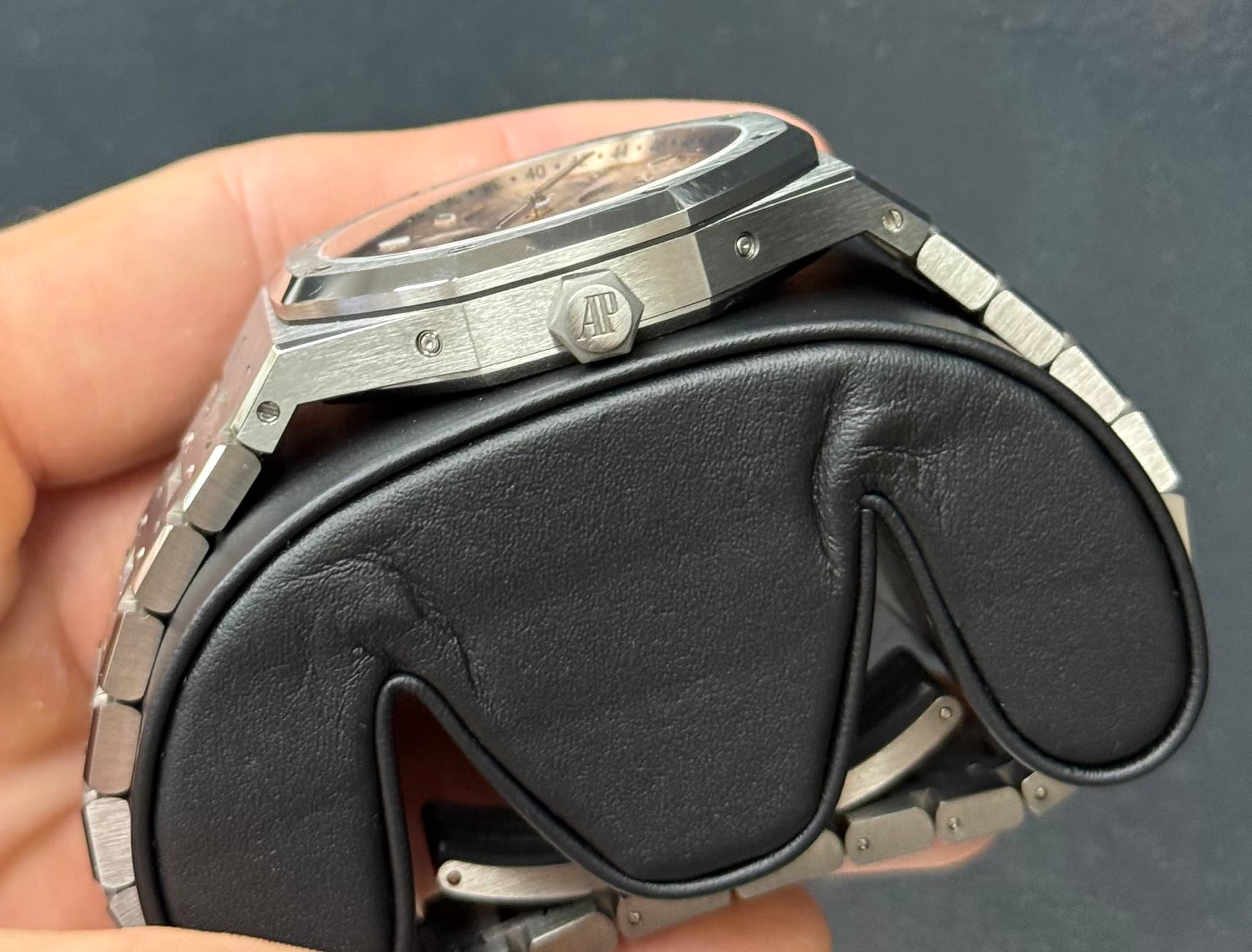 May be an image of wrist watch and text