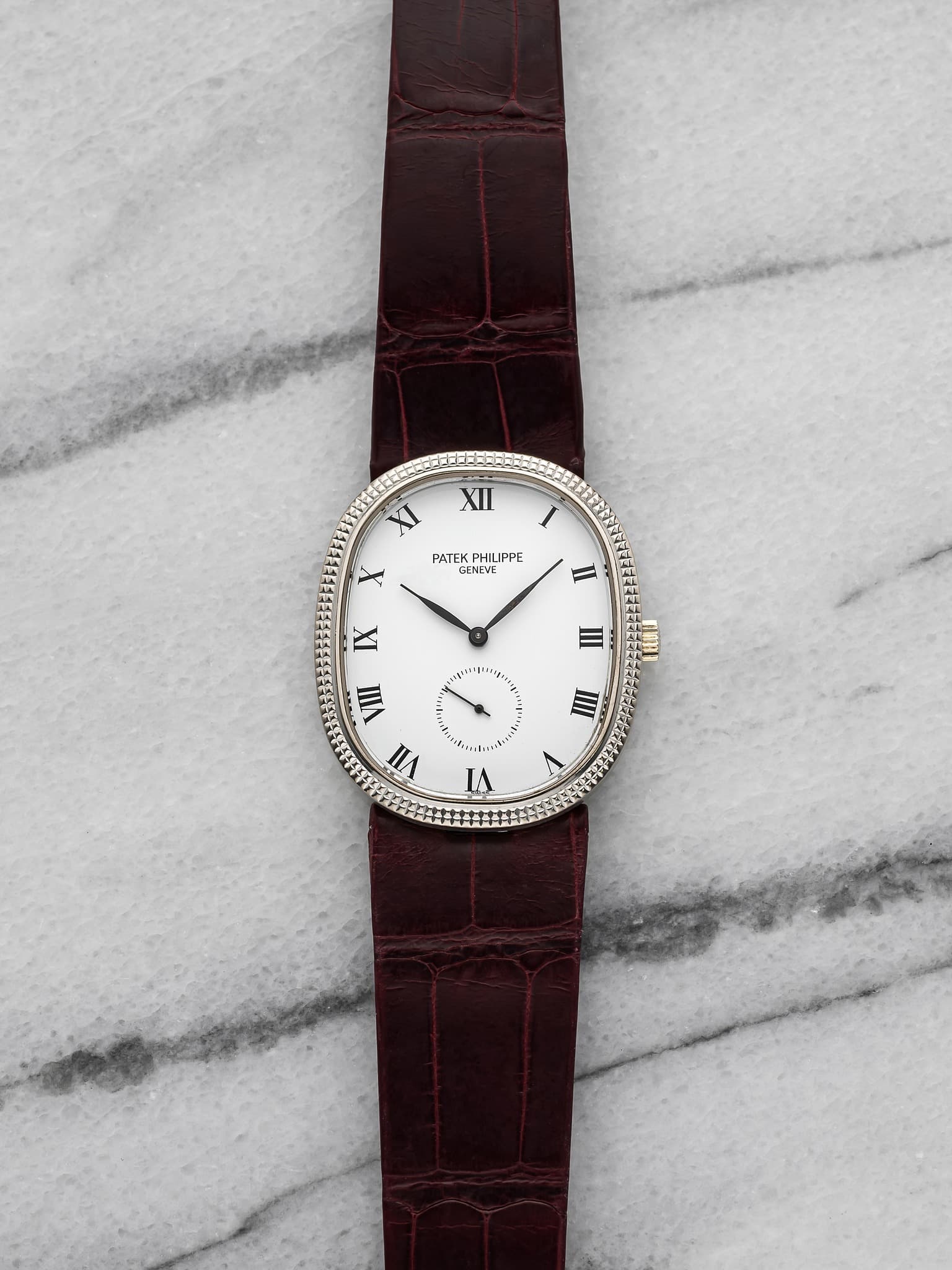 May be an image of leather, wrist watch and text that says 'XII XI PHILIPPE PPE ENEVE X H IX III ء VII VII IIII ت'