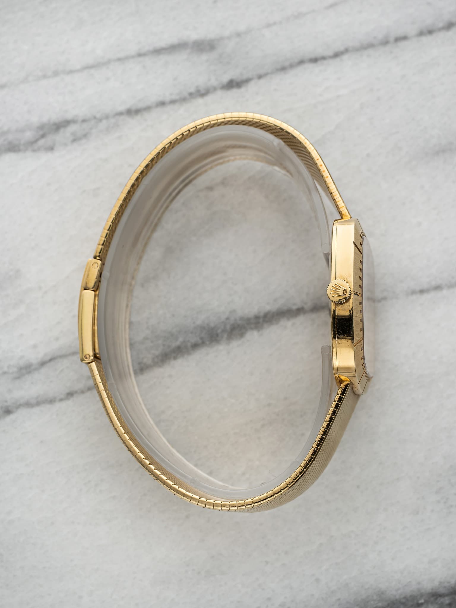 May be an image of wrist watch and jewelry