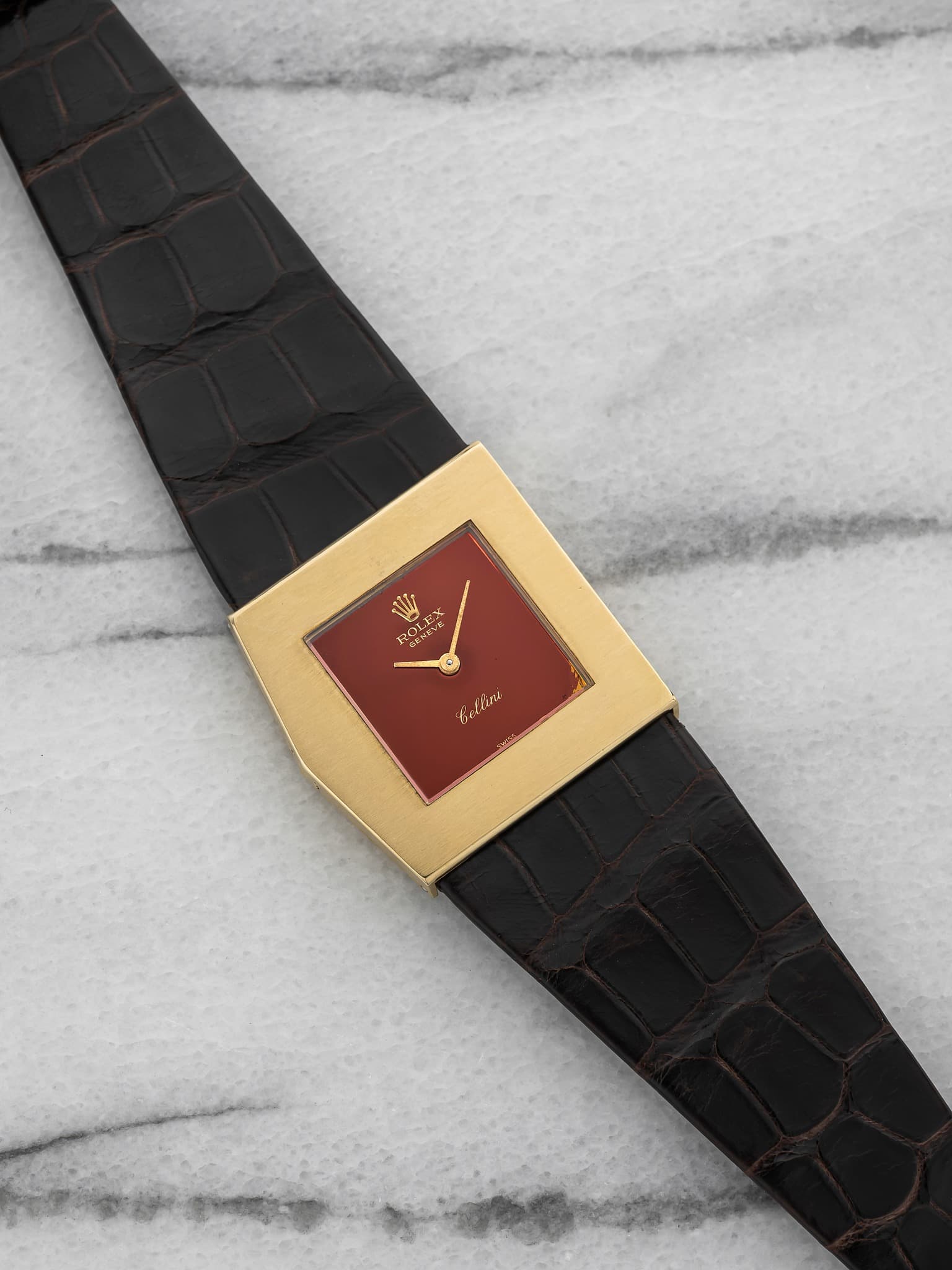May be an image of leather, wrist watch and text