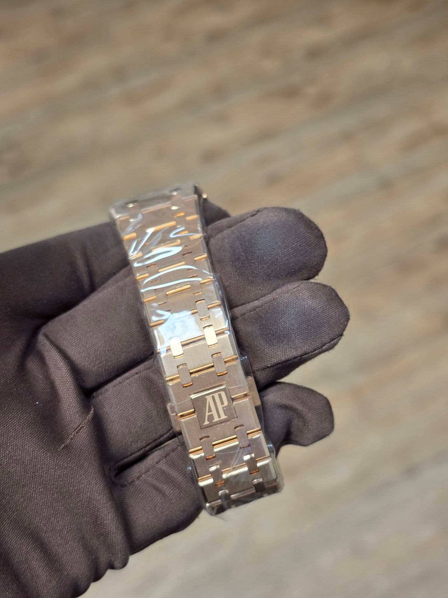 May be an image of leather, wrist watch and text