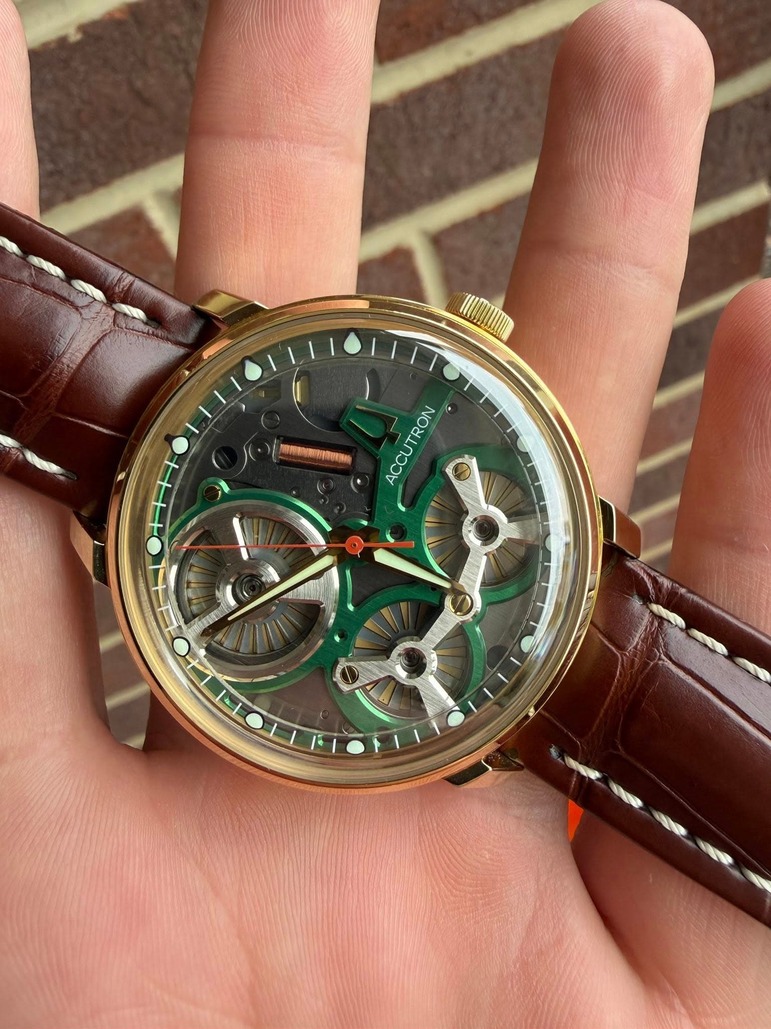 May be an image of wrist watch and text