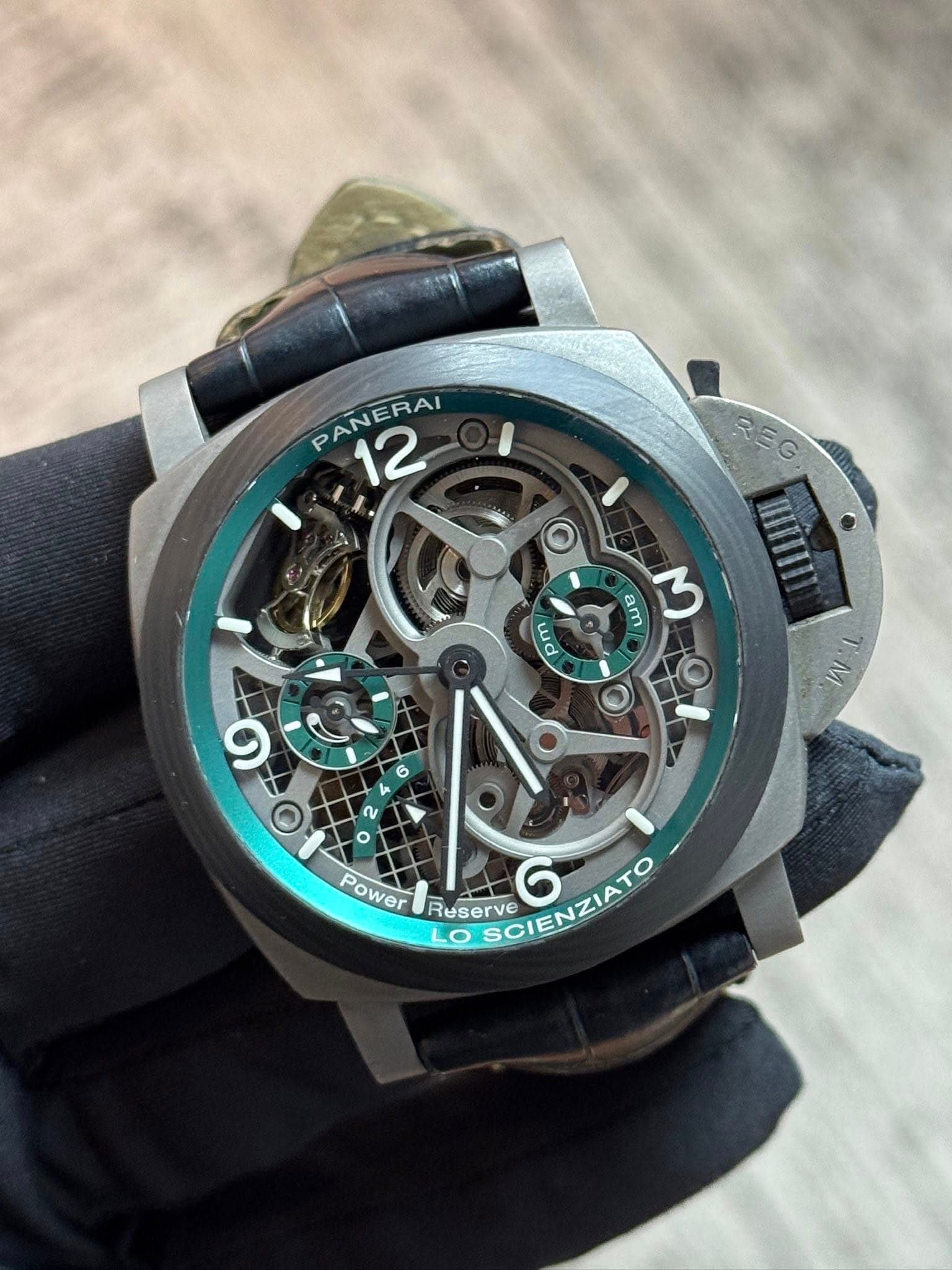 May be an image of wrist watch and text that says 'PANERAI 12 12 REG am M wd nd M Y 9 Ο Power Reserve OSCIENZIATO Ruderve LO SCIENZIATO 6'