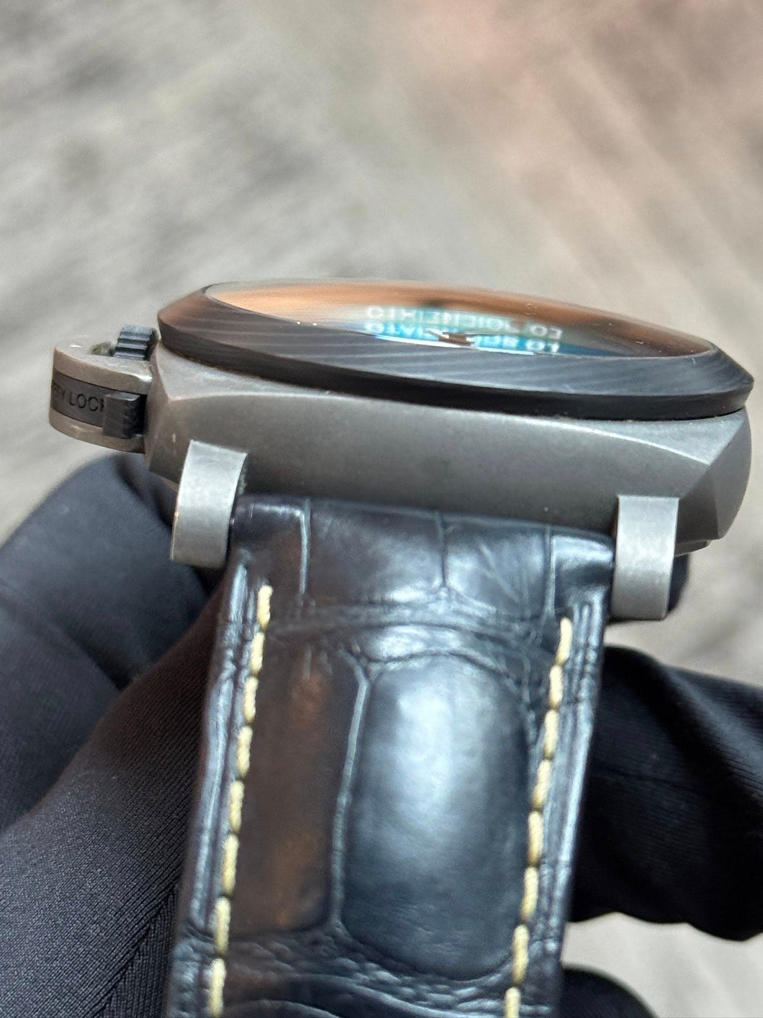 May be an image of wrist watch and text