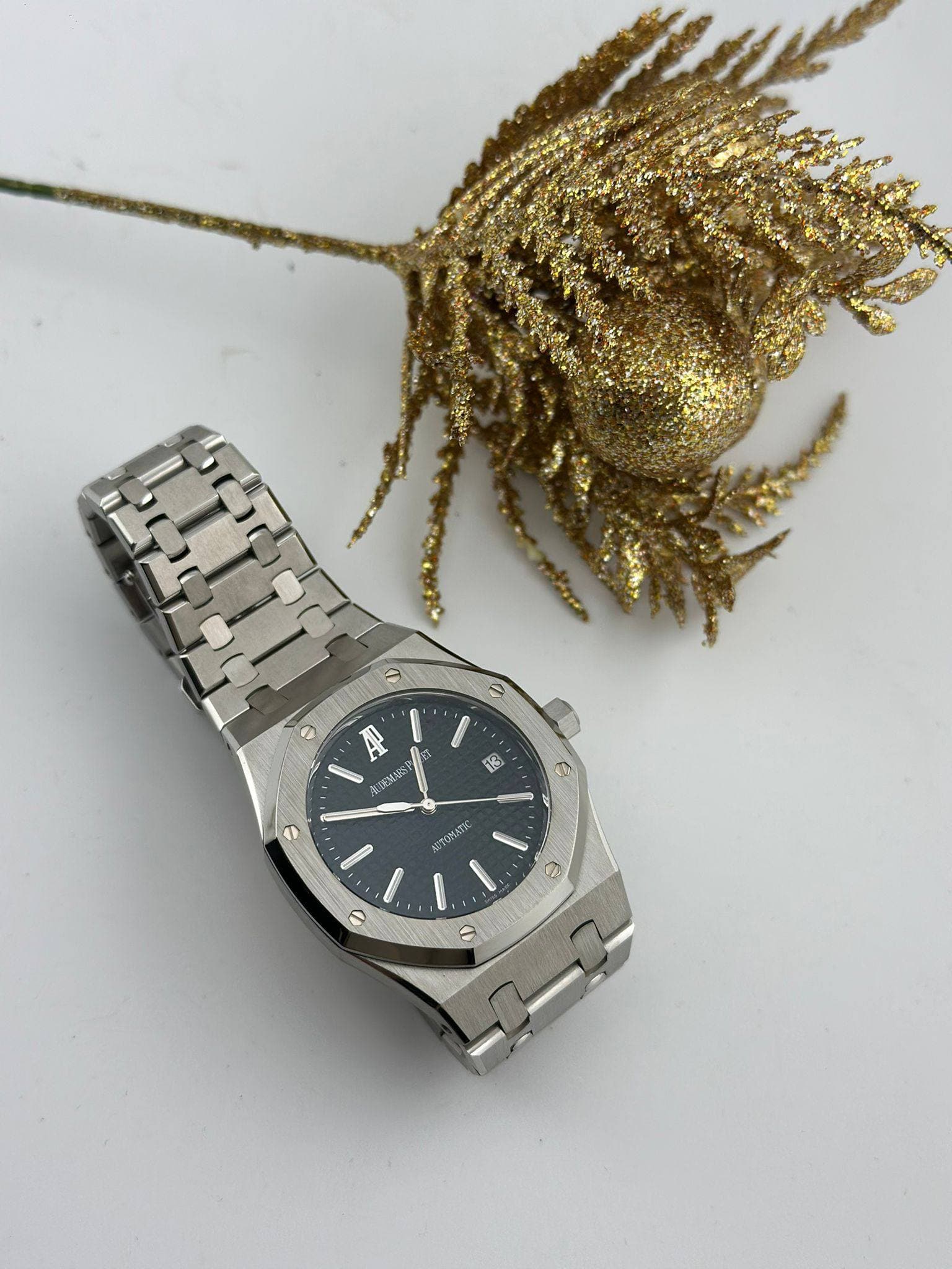 May be an image of wrist watch and text