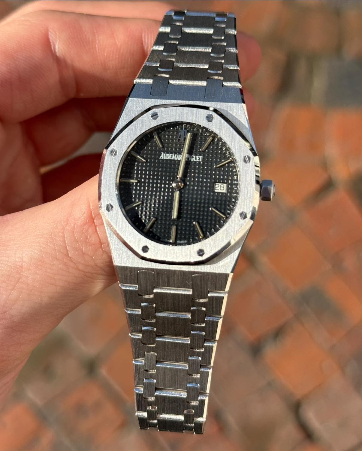 May be an image of wrist watch and text