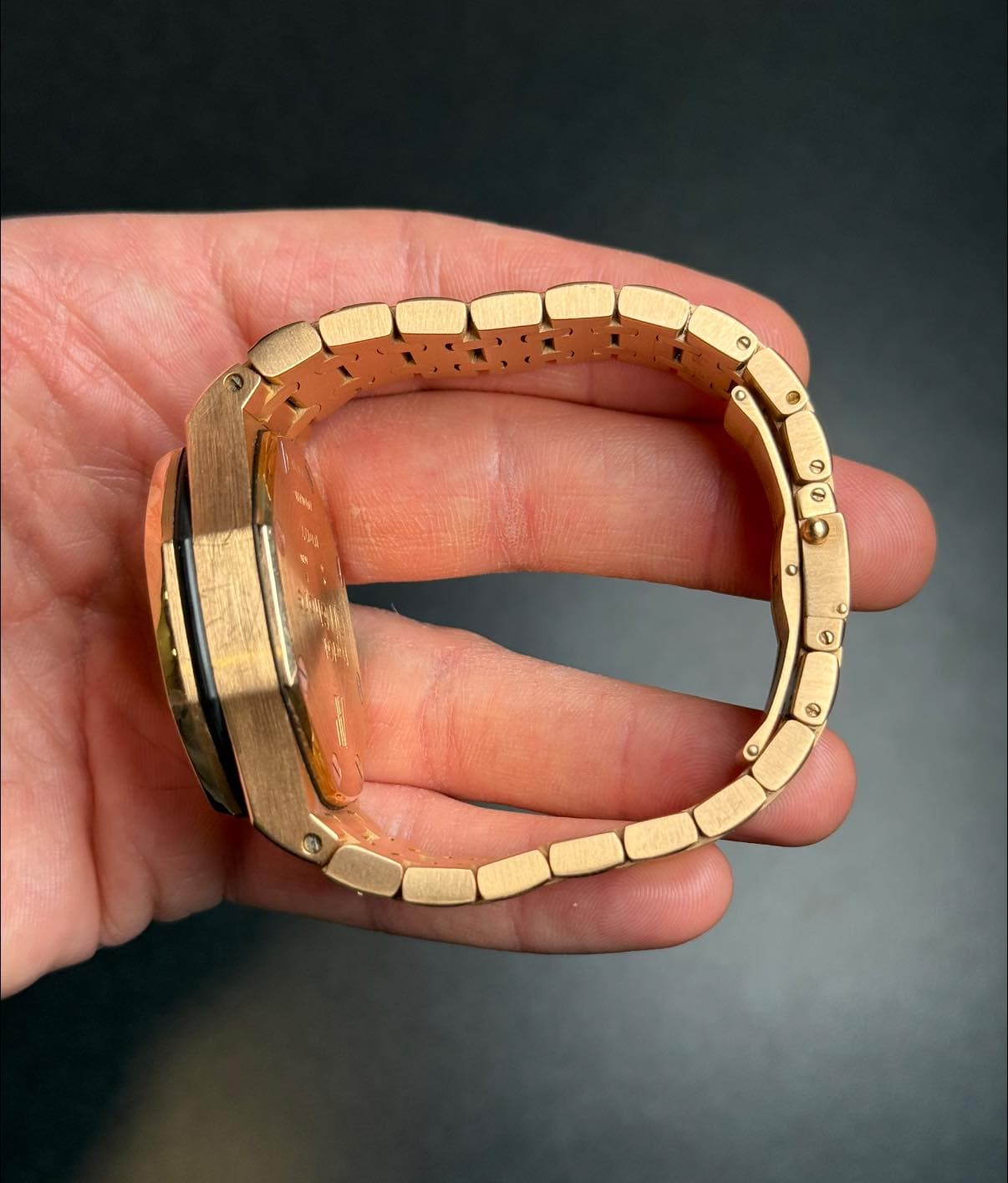 May be an image of brass, wrist watch and jewelry