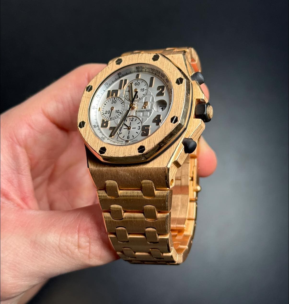 May be an image of wrist watch and text
