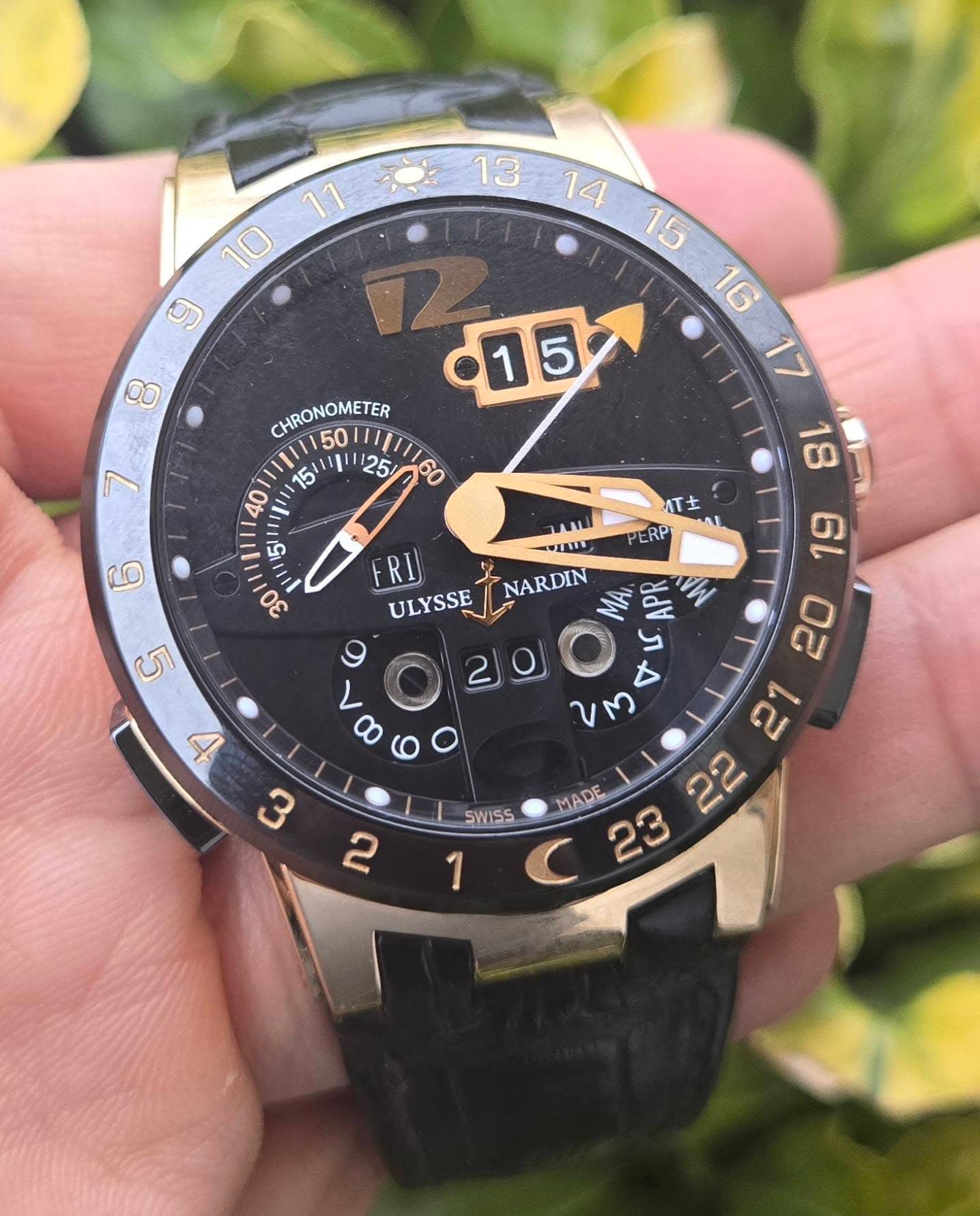 May be an image of digital watch and text that says '11 بِ CHRONOMETER 50 15" مع イ土 PERP G Im 6L RI ULYSSE NARDIN NA ው 200 y 7 00 UM ณ MADE 23 22 A c بن SWISS N 1'