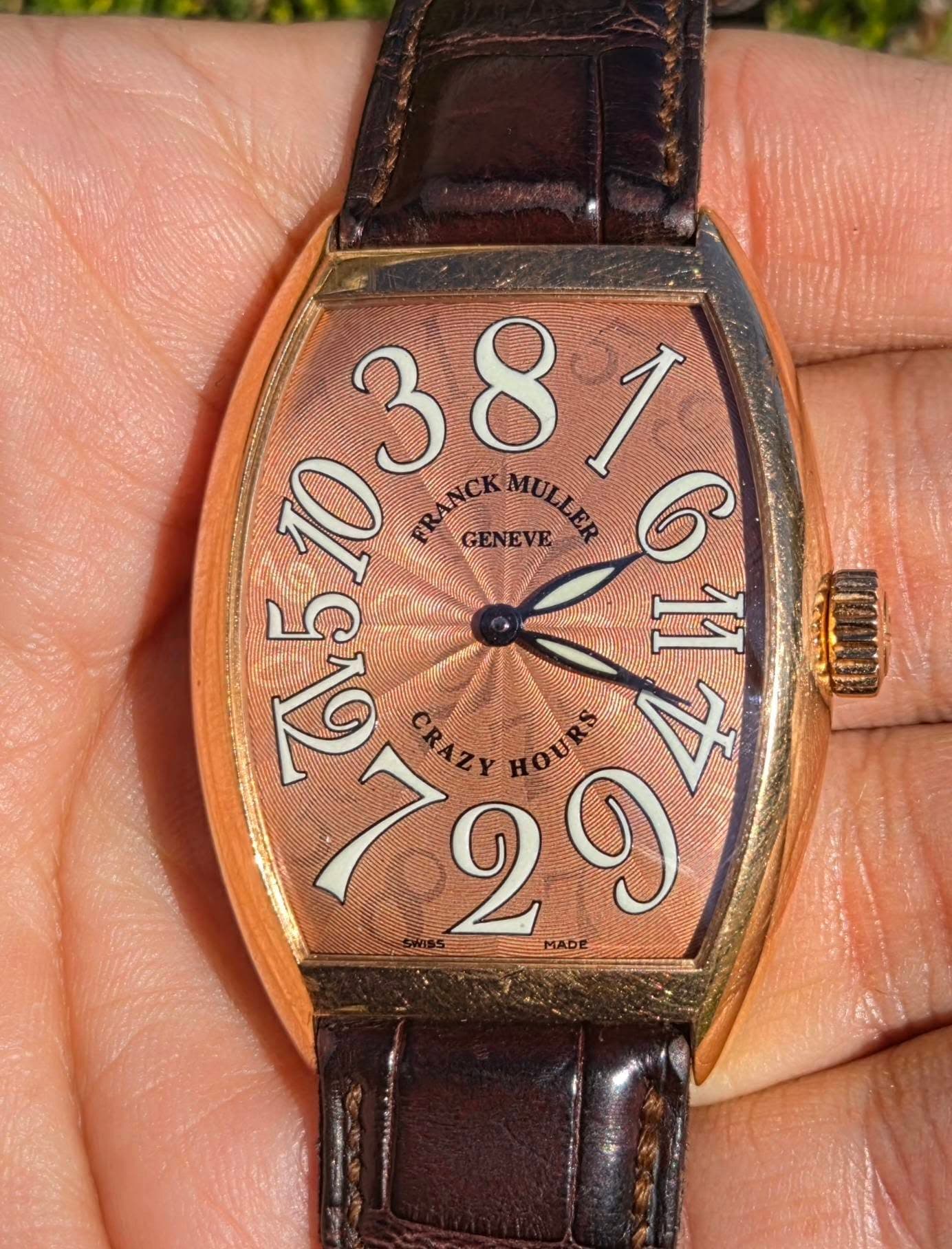 May be an image of wrist watch and text
