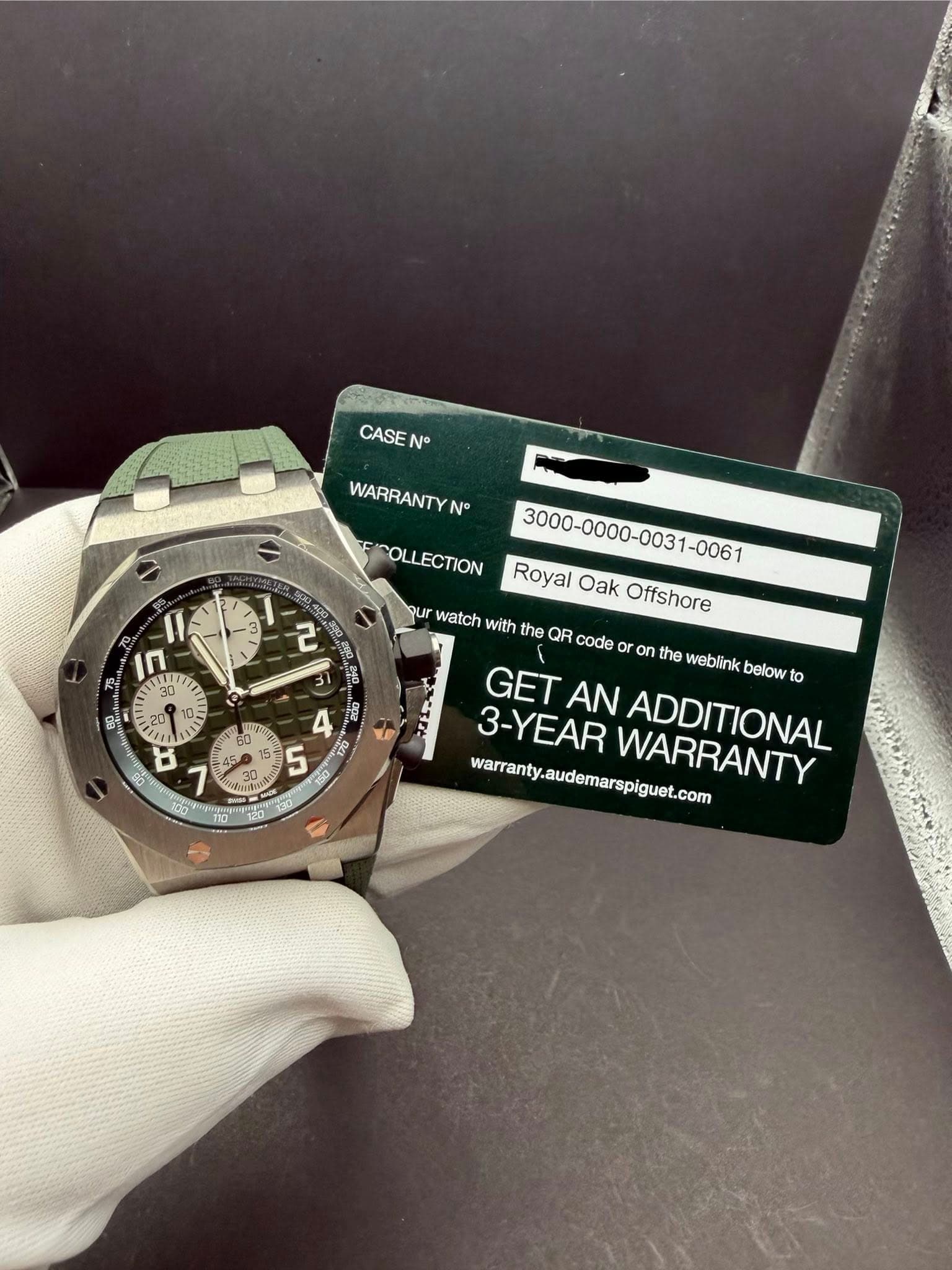 May be an image of wrist watch and text that says 'CASE WARRANTY N 2 IN P 20 20 8 COLLECTION with Royal RoyalOakOffshore Oak Offshore qur watch the QR code or or on the weblink…