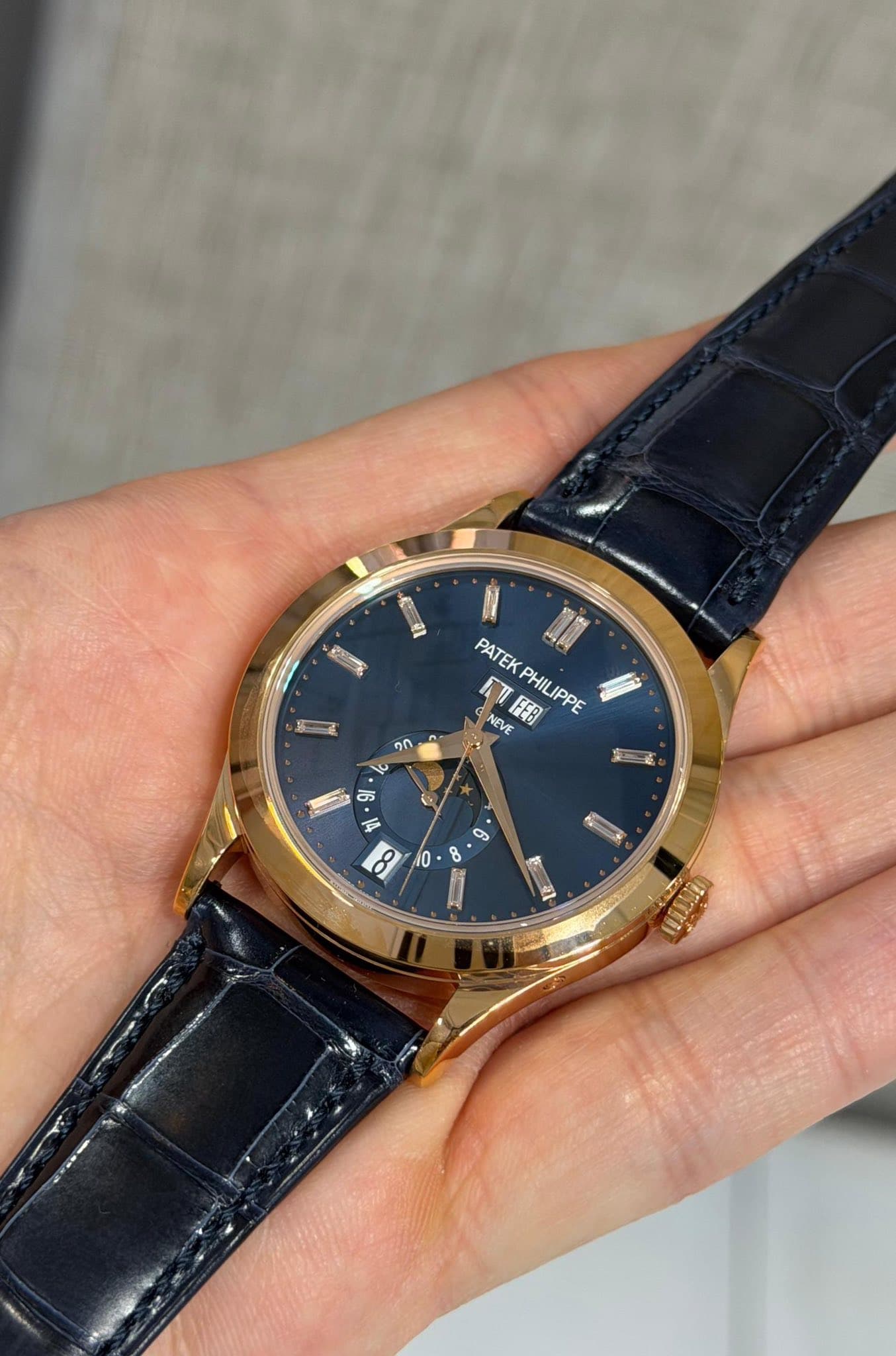 May be an image of wrist watch and text that says 'PATEKPHILIPPE NEV PATEK NEVE FEB PHILIPPE ባለ ऐ ン 한 E W 6 8 و 10 G'