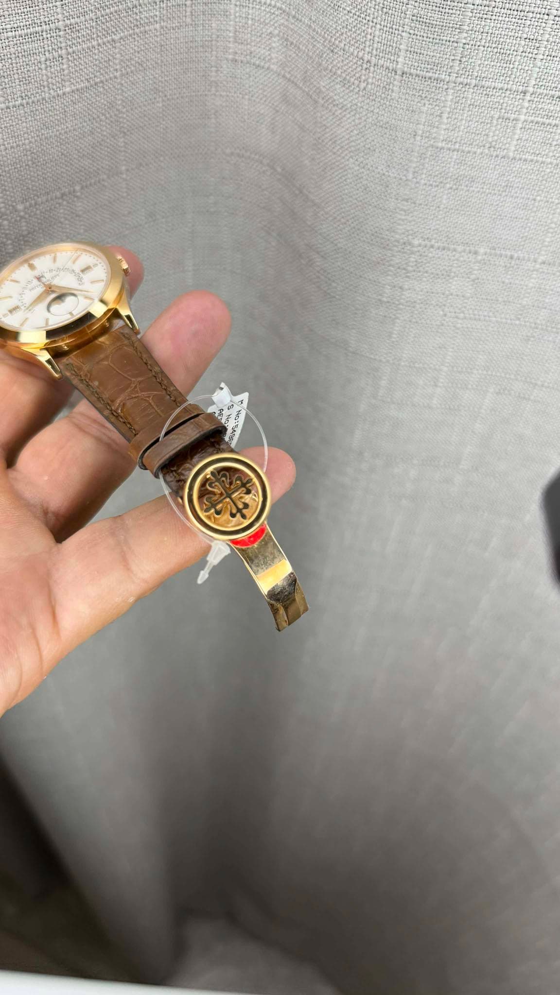 May be an image of wrist watch and text