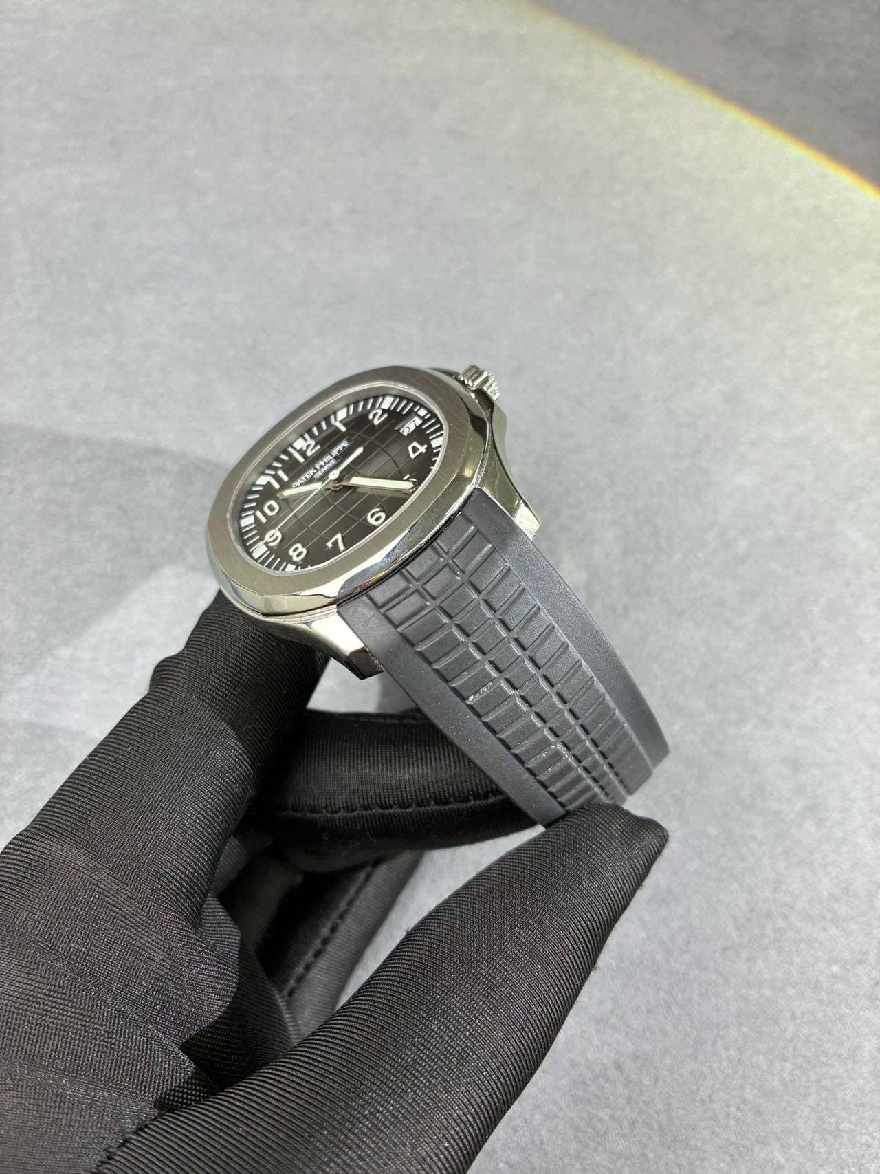 May be an image of wrist watch, leather and text