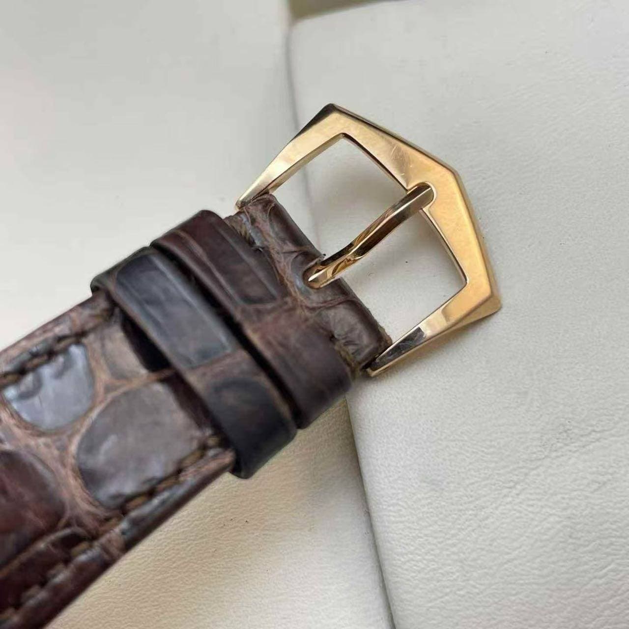 May be an image of wrist watch and saddle-stitched leather