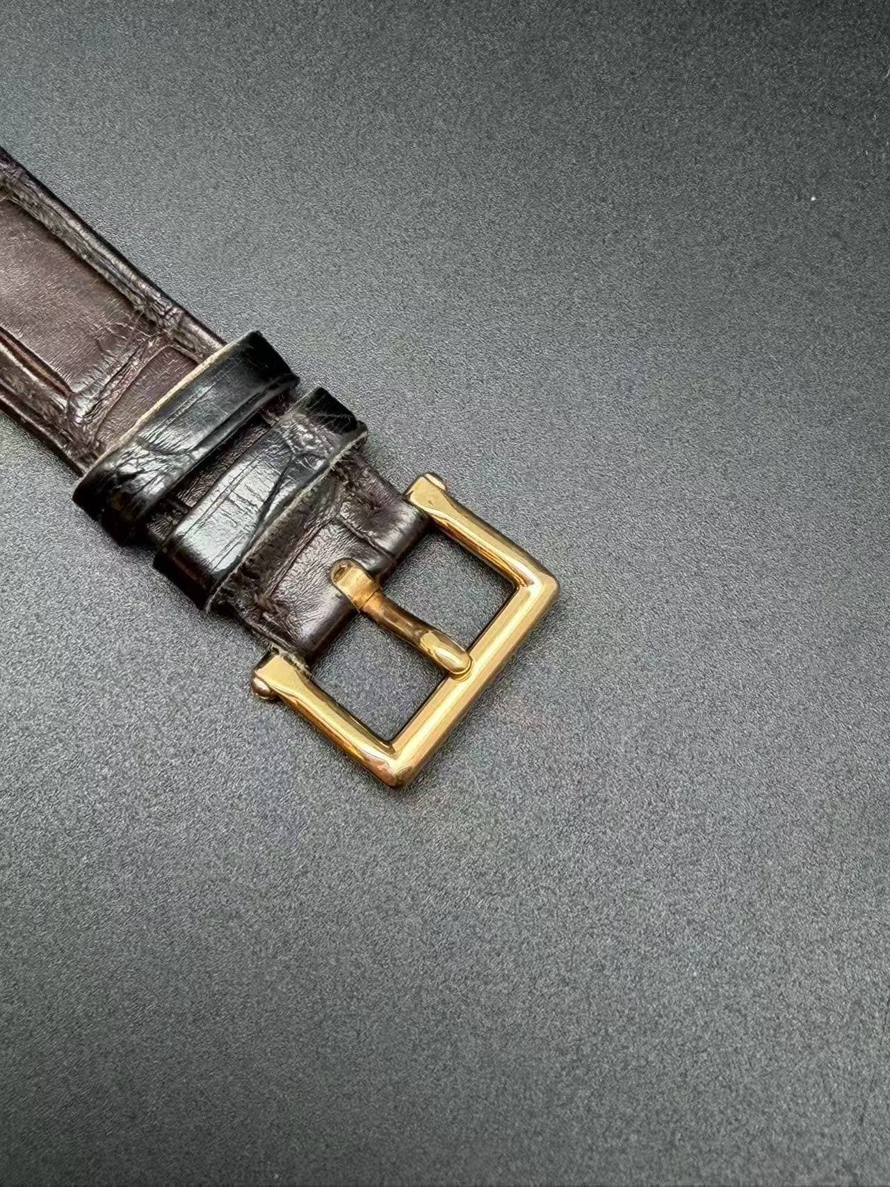 May be an image of leather, wrist watch and saddle-stitched leather