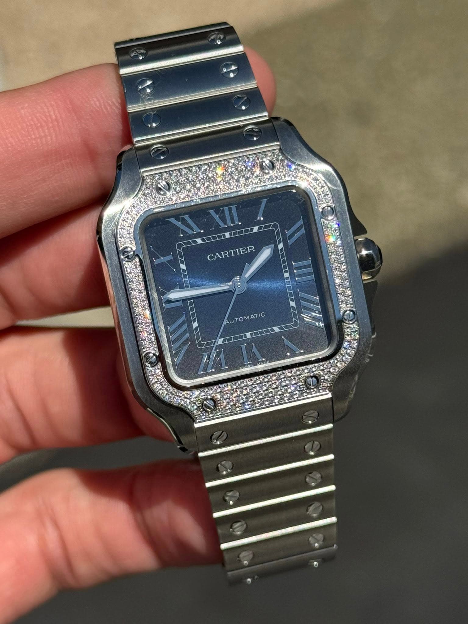 May be an image of digital watch and text that says 'XIXIII CARTIER AUTOMATIC AUTOMATIC OMA 無品'