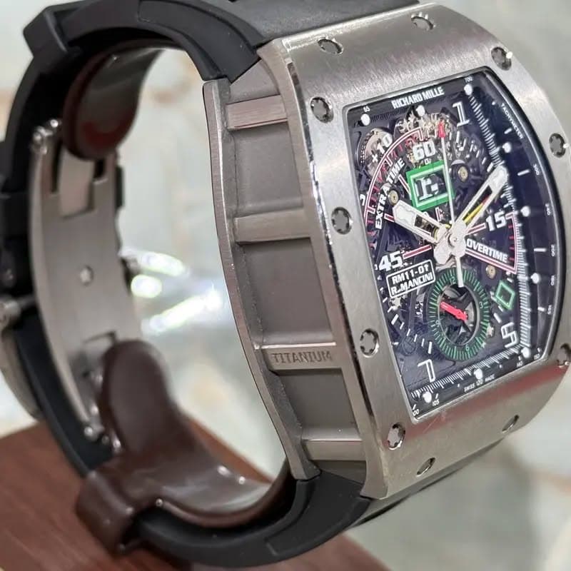 May be an image of wrist watch and text