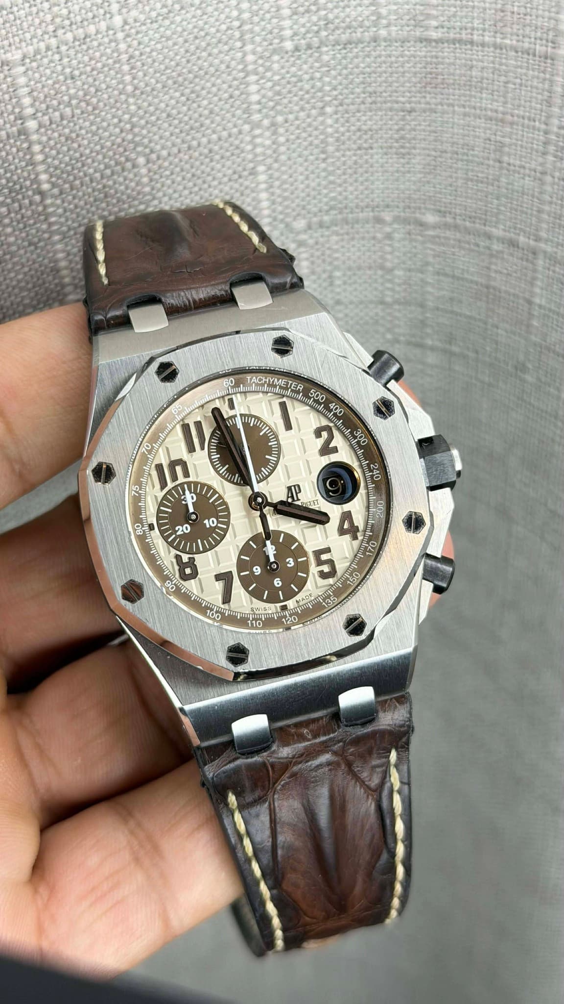 May be an image of wrist watch and text