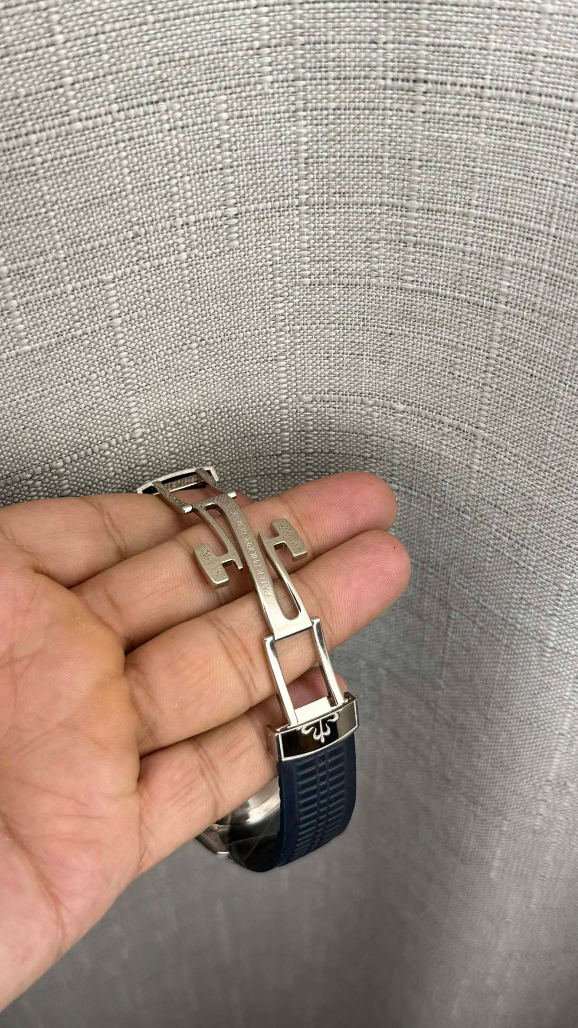 May be an image of jewelry, wrist watch and text