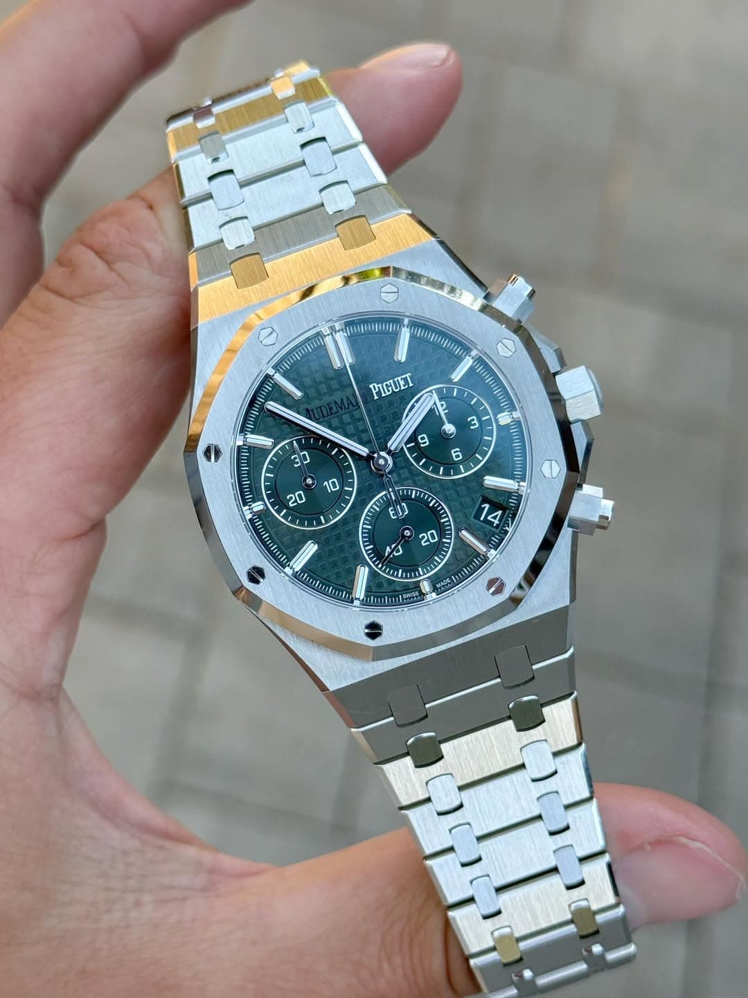 May be an image of wrist watch and text