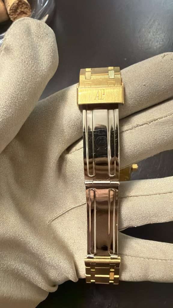 May be an image of wrist watch and jewelry